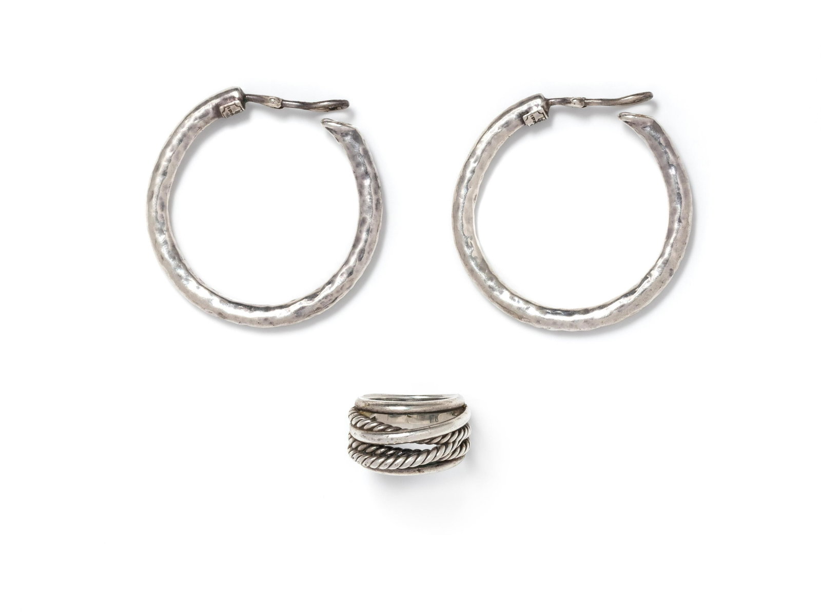 COLLECTION OF STERLING SILVER JEWELRY: COLLECTION OF STERLING SILVER JEWELRY Consisting of a 'Cross-Over' ring by David Yurman, together with a pair of hammered hoop earclips by Ippolita. Stamp: D.Y. 925. Stamp: IPPOLITA 925. 18.00 dwts. P