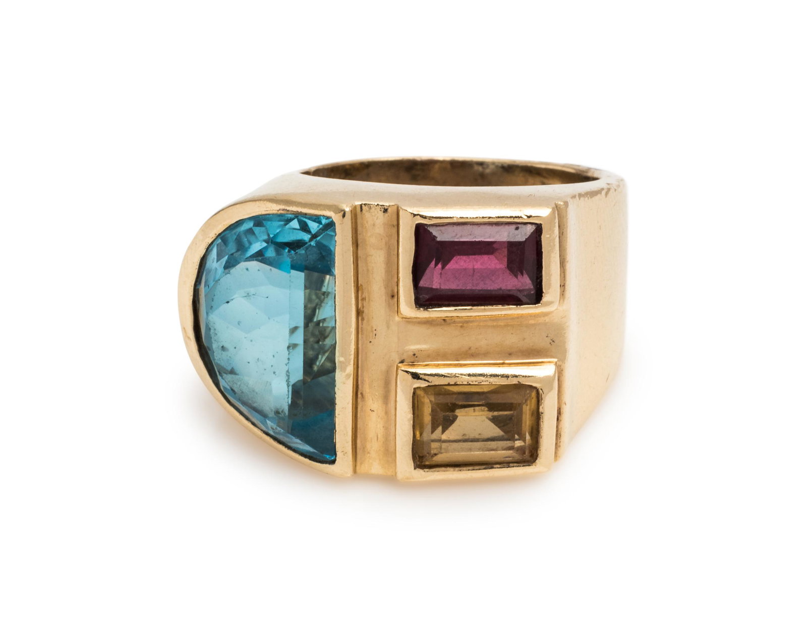 YELLOW GOLD AND MULTIGEM RING: YELLOW GOLD AND MULTIGEM RING Containing one half-moon shape blue topaz, one rectangular step cut citrine and one rectangular step cut garnet. Stamp: GB 14K. 8.40 dwts. Property of an Estate, St. Loui