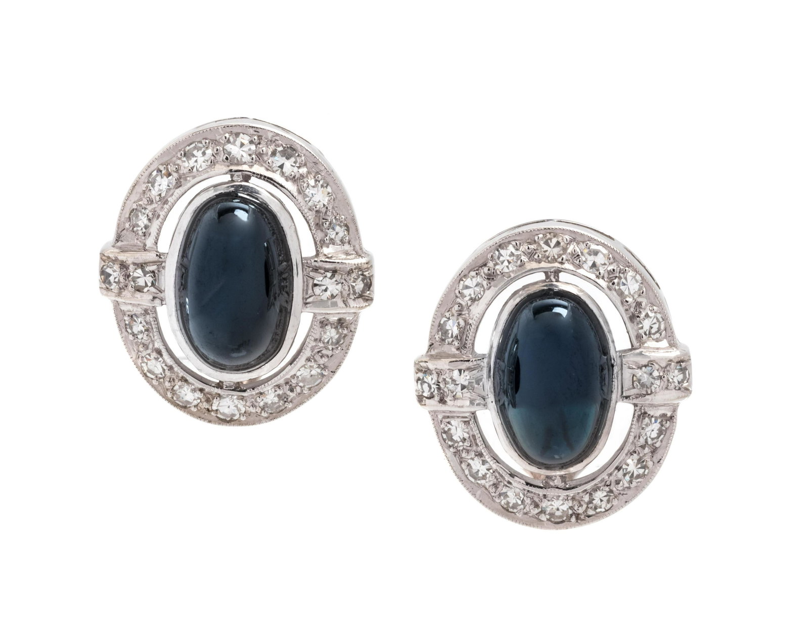 SAPPHIRE AND DIAMOND EARCLIPS: SAPPHIRE AND DIAMOND EARCLIPS Containing one oval shape cabochon cut blue sapphire and one oval shape cabochon cut black sapphire measuring approximately 10.80 x 6.90 mm and 36 single cut diamonds wei