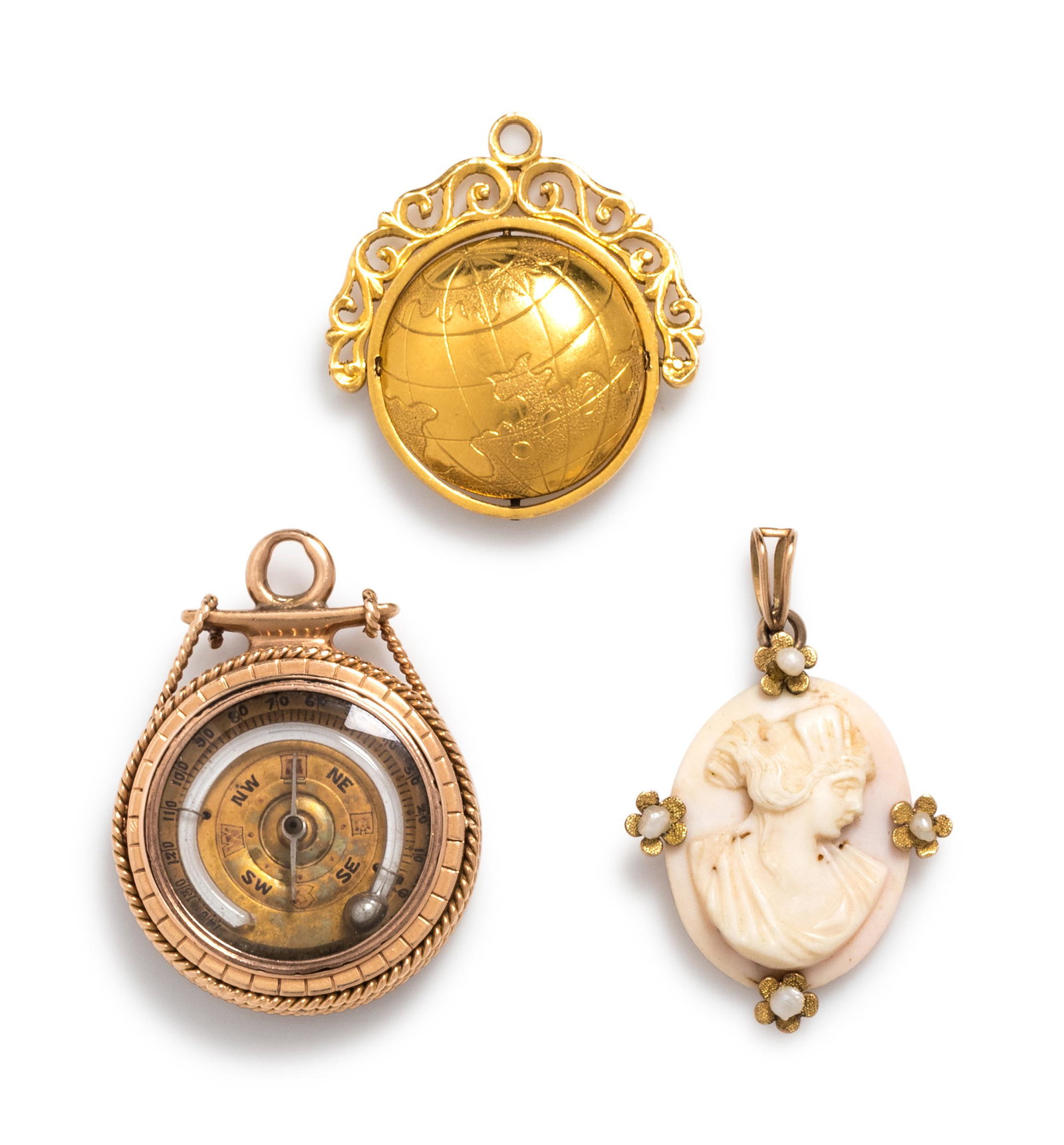 COLLECTION OF GOLD PENDANTS: COLLECTION OF GOLD PENDANTS Consisting of a rose gold compass pendant containing a carved onyx monogram, a yellow gold globe locket pendant, together with a yellow gold and shell cameo pendant. Globe 