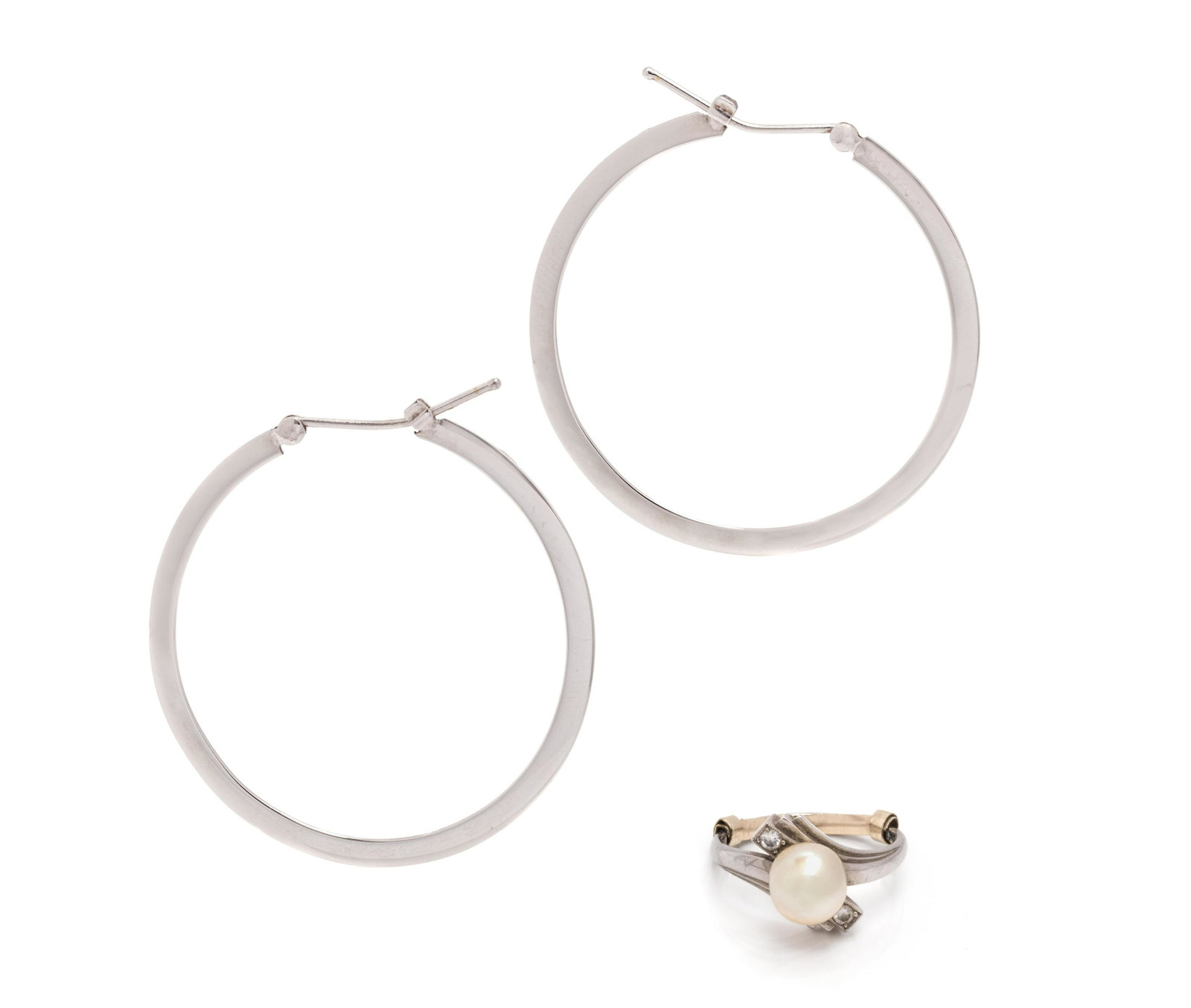 COLLECTION OF WHITE GOLD JEWELRY: COLLECTION OF WHITE GOLD JEWELRY Consisting of a pair of white gold hoop earrings, together with a ring by Mikimoto containing one out of round cultured pearl measuring approximately 8.00 mm in diamet