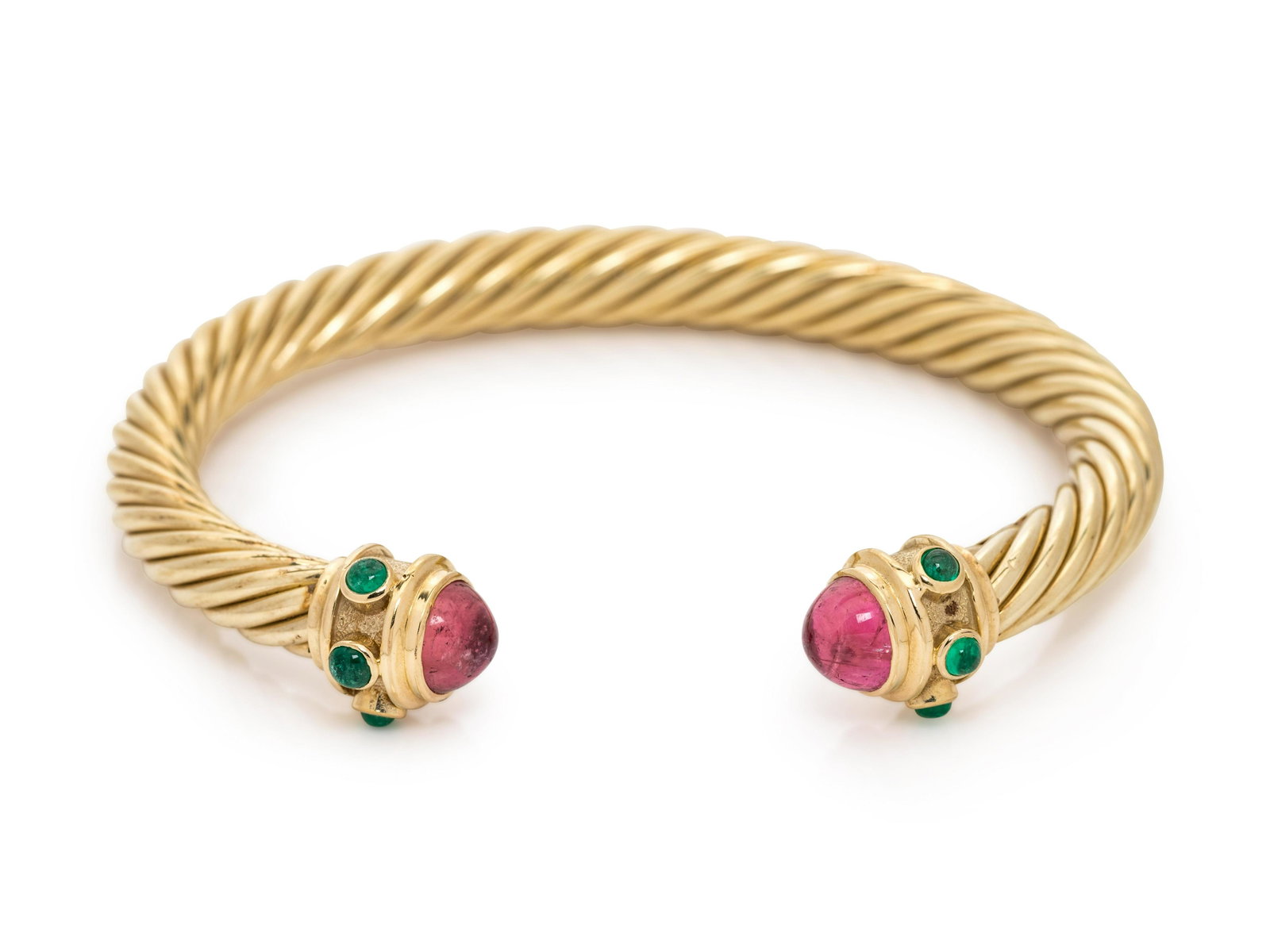 DAVID YURMAN, YELLOW GOLD AND GEMSTONE 'RENAISSANCE': DAVID YURMAN, YELLOW GOLD AND GEMSTONE 'RENAISSANCE' CUFF BRACELET Consisting of a cable measuring approximately 7.00 mm wide, the terminals containing two round cabochon cut pink tourmalines measurin