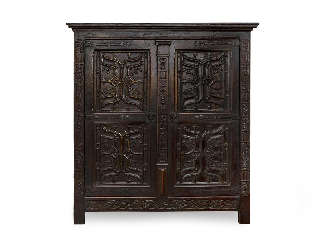A Renaissance Revival Carved and Stained Oak Kas Height: A Renaissance Revival Carved and Stained Oak Kas 19TH CENTURY Height 72 x width 67 x depth 22 inches.