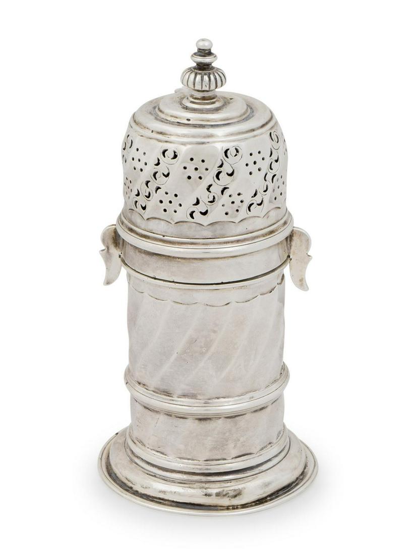 A Victorian Silver Sugar Caster Height 6 1/4 x diameter: A Victorian Silver Sugar Caster Charles Stuart Harris, London, 1895, Brittania Standard 6 ozts. 95 dwts. Height 6 1/4 x diameter 3 inches.