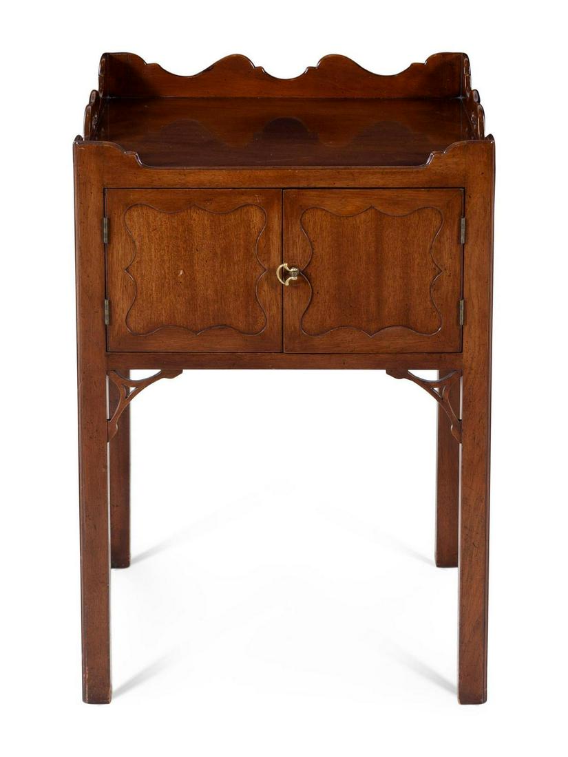 A George III Style Mahogany Bedside Commode: A George III Style Mahogany Bedside Commode 20TH CENTURY Height 30 x width 21 x depth 19 1/2 inches. With rectangular top over two doors, raised on square legs. Property from the Collection of Karl Ze
