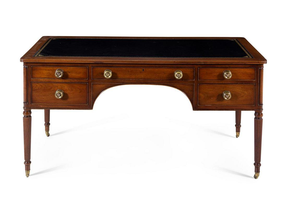 A Regency Style Mahogany Writing Desk: A Regency Style Mahogany Writing Desk KITTINGER 20TH CENTURY Height 30 1/2 x width 60 x depth 29 inches. Having a rectangular leather inset top. Property from the Collection of Karl Zeisler, Chicago,