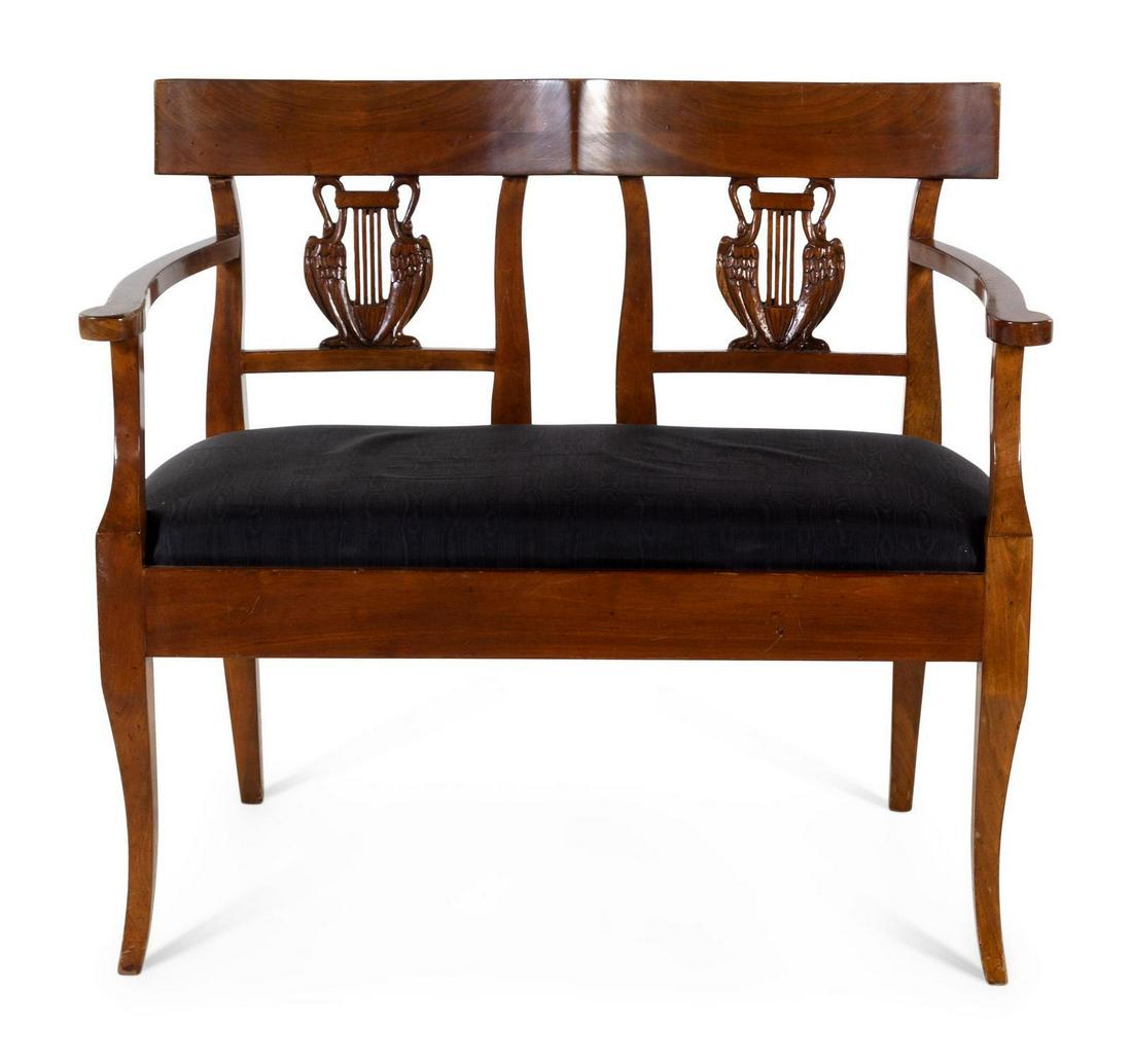 An Italian Neoclassical Style Walnut Double Chairback: An Italian Neoclassical Style Walnut Double Chairback Settee 20TH CENTURY Width 37 1/2 inches. With swan-carved splats and upholstered seat. Property from the Collection of Karl Zeisler, Chicago, Illi