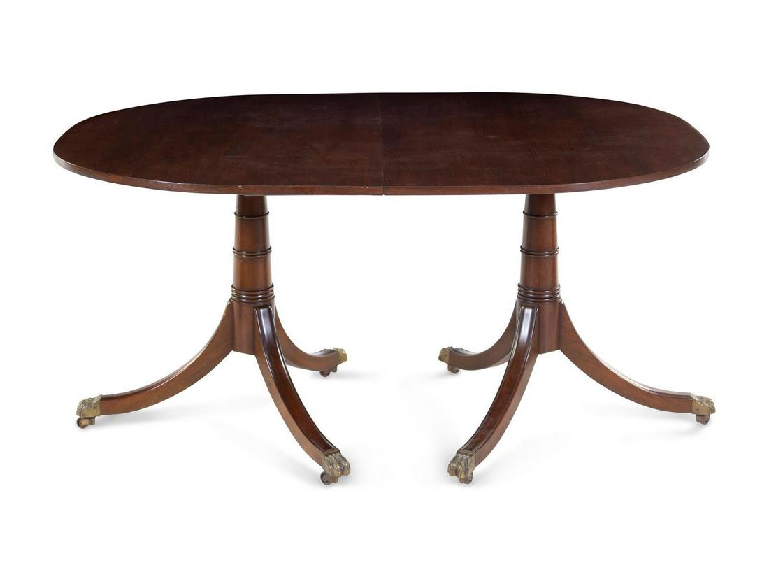 A George III Style Mahogany Two-Pedestal Dining Table: A George III Style Mahogany Two-Pedestal Dining Table 20TH CENTURY Height 30 x width 60 x depth 42 inches. With ring turned standards. Property from the Collection of Karl Zeisler, Chicago, Illinois