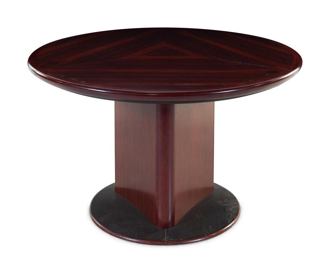 Skovby: Skovby Denmark, Mid-20th Century expandable dining table with three leaves rosewood, laminateÂ manufacturer's paper label to underside Height 29 x diameter 57 inches. Property from the Estate of Ge