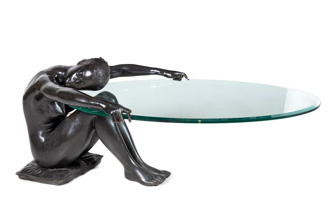 A Patinated Bronze and Glass Low Figural Table: A Patinated Bronze and Glass Low Figural Table Height 22 x width 55 x depth 30 inches.