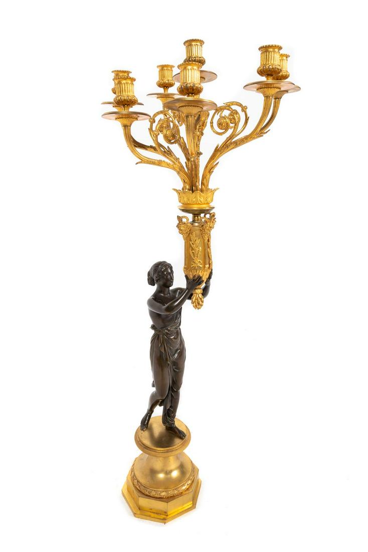 A French Gilt and Patinated Bronze Seven-Light Figural: A French Gilt and Patinated Bronze Seven-Light Figural Candelabrum Mid-19th Century Height 38 3/4 inches. Provenance: S&G Intertrus Antiques, New York Property from the Collection of Michael and Janic