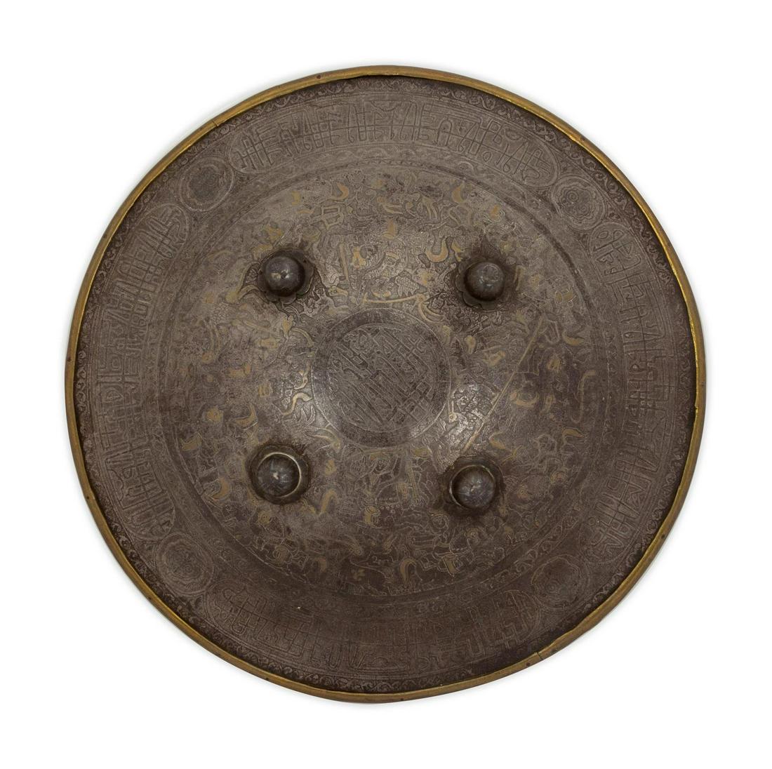 An Ottoman Metal Inlaid Shield Diameter: An Ottoman Metal Inlaid Shield Mid-19th Century Diameter 18 inches.