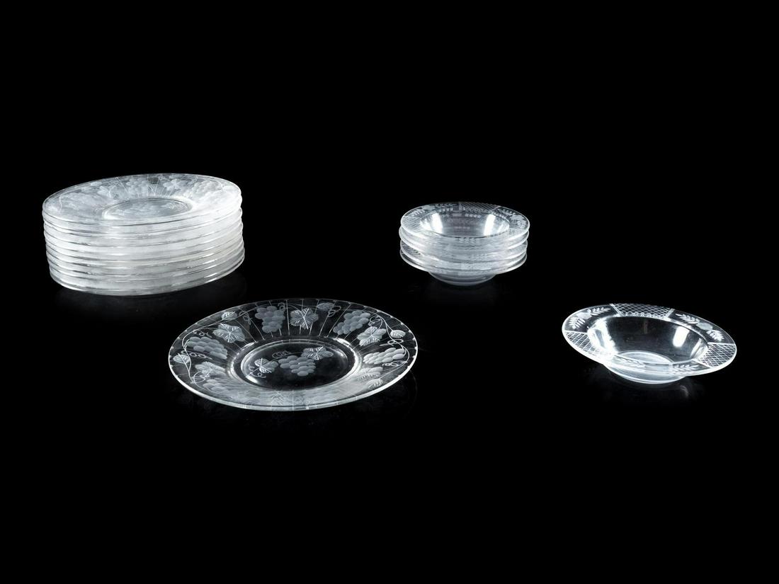 An Assembled Set of Etched Glass Tableware: An Assembled Set of Etched Glass Tableware 20th Century comprising twelve plates and six bowls. Diameter of plates 8 3/4 inches, diameter of bowls 5 3/4 inches.