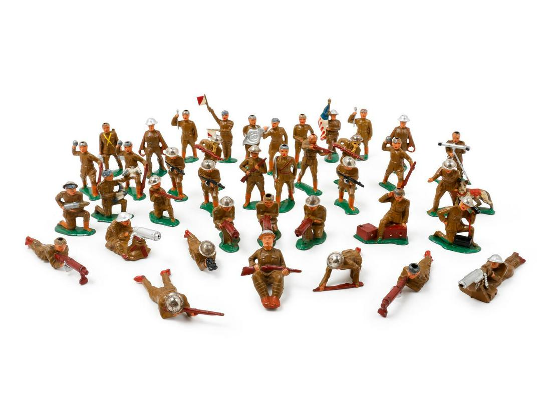 A Collection of Painted Metal American DoughboyÂ Toy: A Collection of Painted Metal American Doughboy Toy Soldiers comprising infantry, medical and communication examples. 39 items total, together with a barbed-wire prop. Height of tallest 4 inches.