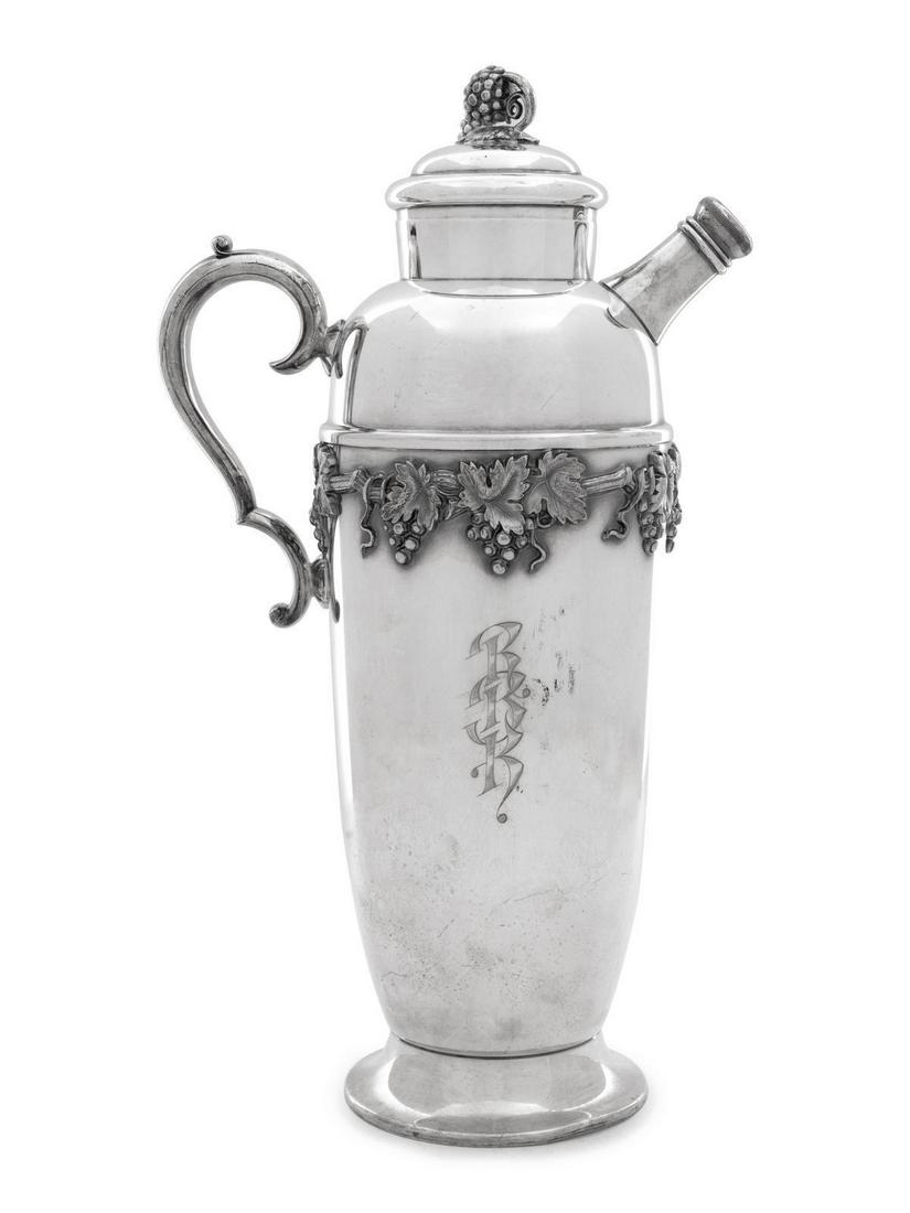 A Collection of Silver-Plate Articles: A Collection of Silver-Plate Articles Early 20th Century and Later comprising a Christofle silver-plate mounted glass bottle,Â cocktail shaker, wine cooler, wine bottle coaster, three salt cellars,