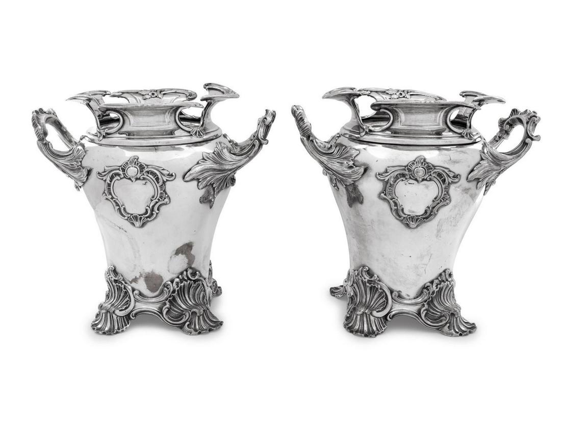 A Pair of Silver-Plate Wine Coolers: A Pair of Silver-Plate Wine Coolers First Quarter 20th Century one with a presentation inscription to underside. Height 10 1/2 inches.Â