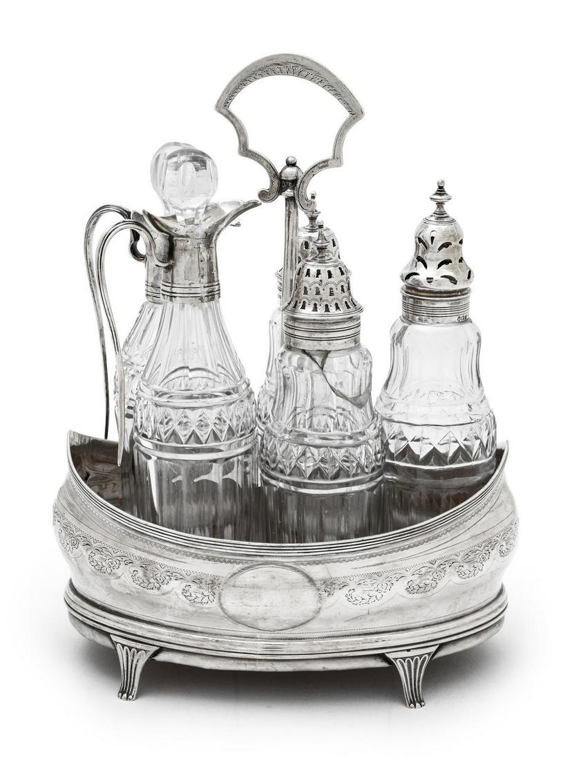 A George III Silver Cruet Set: A George III Silver Cruet Set Peter & Ann Bateman, London, 1804 with five silver-mounted glass bottles. hallmarked for sterling on base rim Height 9 1/4 inches.Â