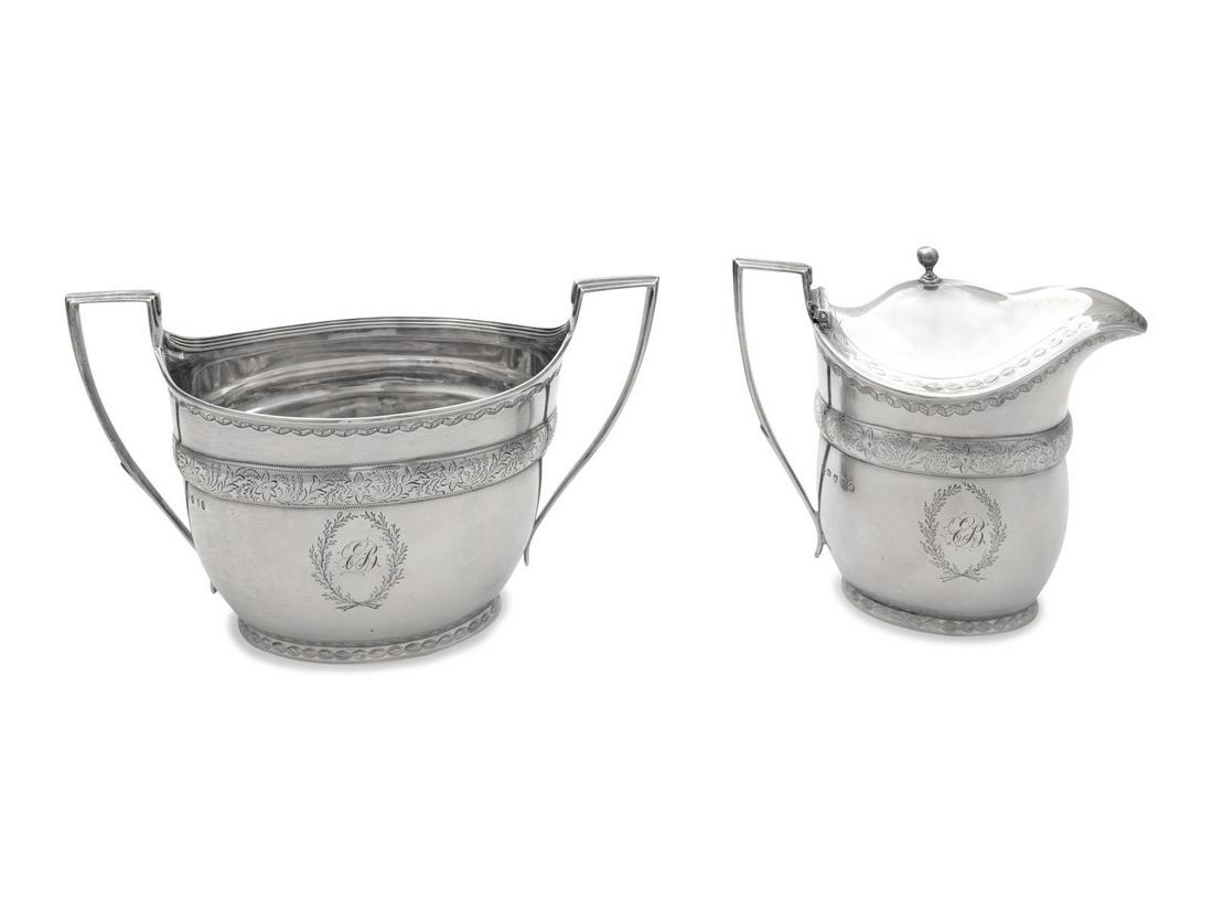 A George III Silver Sugar and Covered Creamer: A George III Silver Sugar and Covered Creamer John Emes, London, 1800 each with a floral and foliate engraved band on body surmounting a monogram within a floral cartouche. each hallmarked for Sterlin