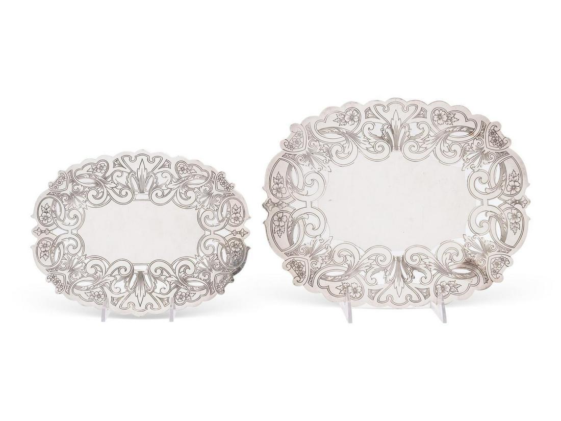 A Collection of English and American Silver-Plate Table: A Collection of English and American Silver-Plate Table Articles 19th Century and Later comprising a leather cased set of four salt cellars, two oval form trivets, two circular trivet wine bottle coas