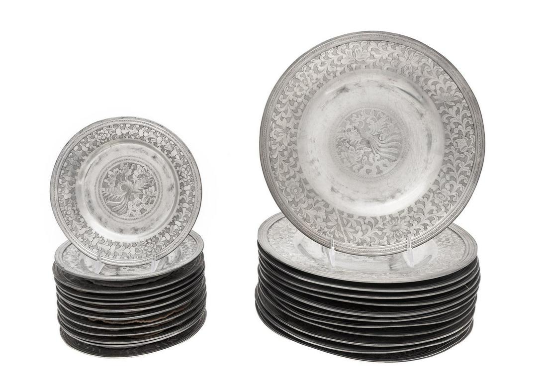 A Set of Chinese Metal Dinnerware Articles: A Set of Chinese Metal Dinnerware Articles 20th Century comprising 12 dinner plates and 12 dessert plates. Diameter of dinner plate 11 inches.