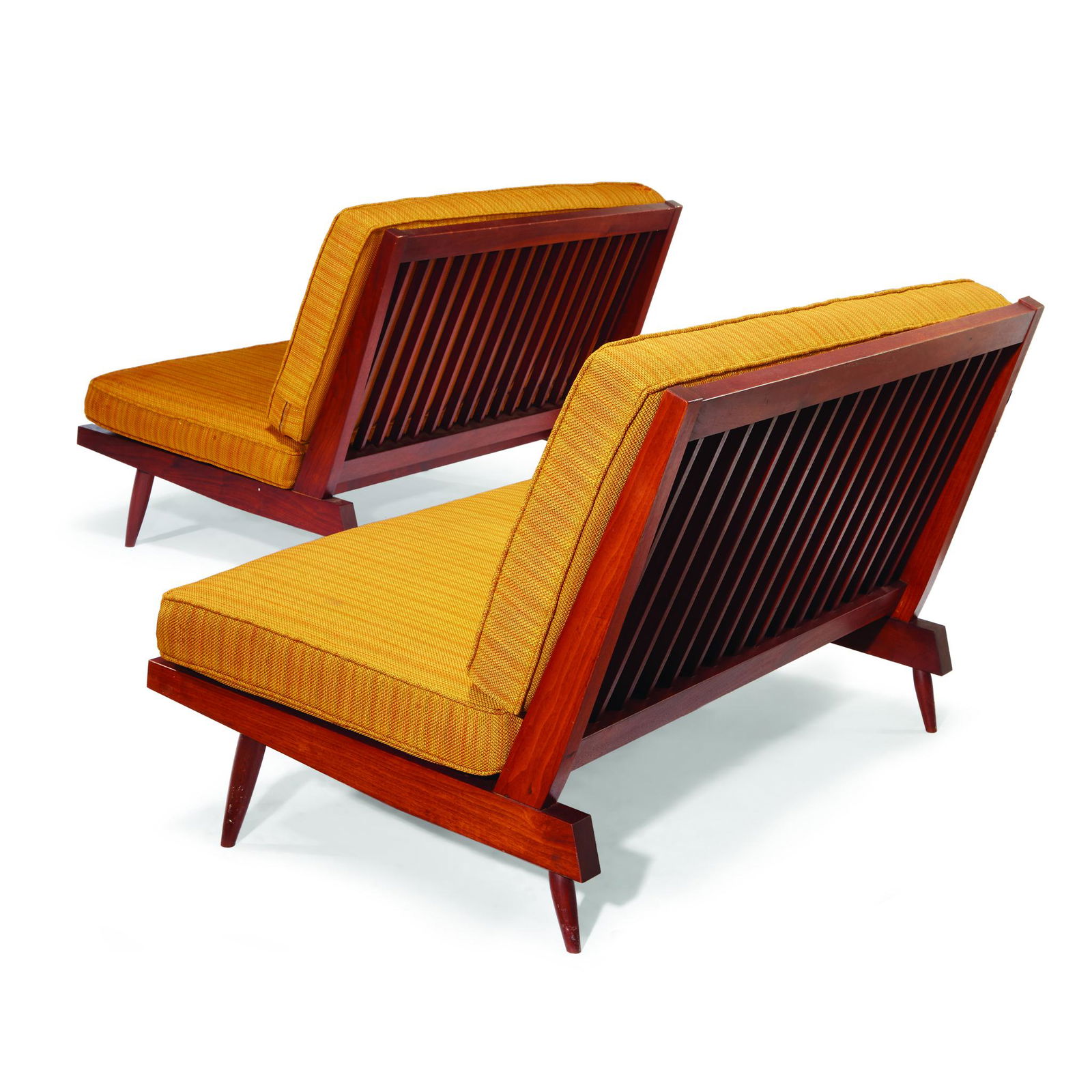 George Nakashima (American, 1905-1990), A Pair of: George Nakashima (American, 1905-1990)A Pair of Settees, New Hope, Pennsylvania, 1954 American black walnut, upholstery. H: 31, W: 48, D: 31 in. PROVENANCE: Acquired directly from the artist Thence by
