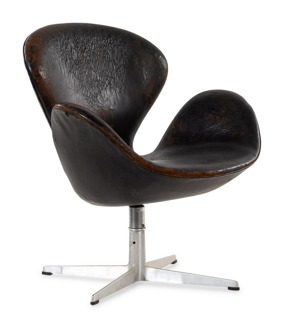 Arne Jacobsen (Danish, 1902-1971) Swan Lounge Chair: Arne Jacobsen (Danish, 1902-1971) Swan Lounge Chair Fritz Hansen, Denmark leather, aluminum manufacturer's label to underside H 32 x W 29 x D 22 inches Please Note: This work is located and will ship