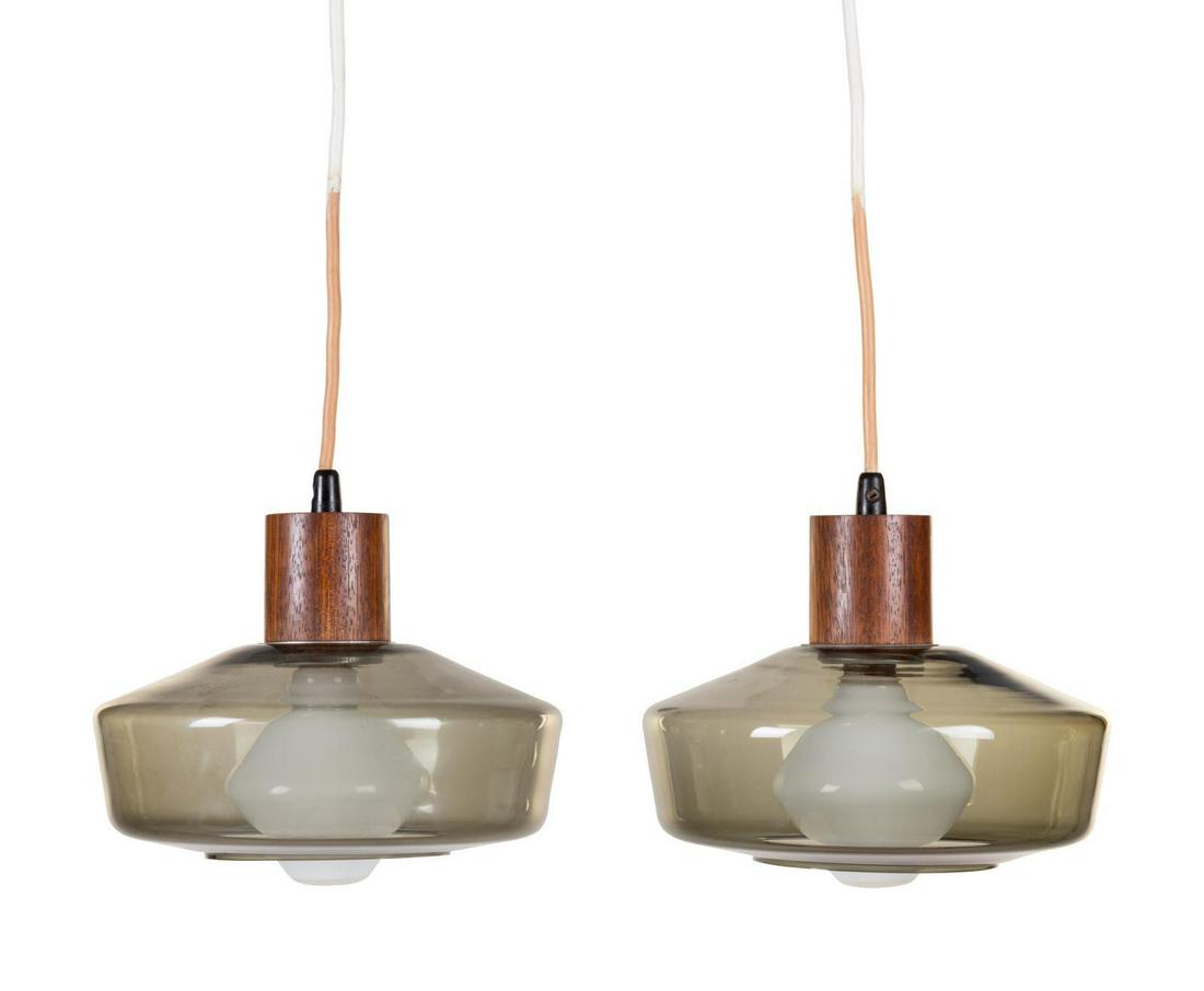 Lyfa | Orrefors Denmark, Sweden, Mid 20th Century Pair: Lyfa | Orrefors Denmark, Sweden, Mid 20th Century Pair of Pendant Lightswith Light Bulbs by Tapio WirkkalaAiram, Finland wood, glass, frosted glass, enameled aluminum unmarked Each | H 8 x Diameter 9