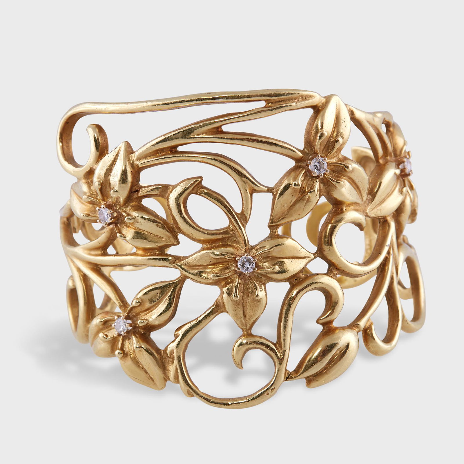 An eighteen karat gold and diamond cuff bracelet, (1 of 2)
