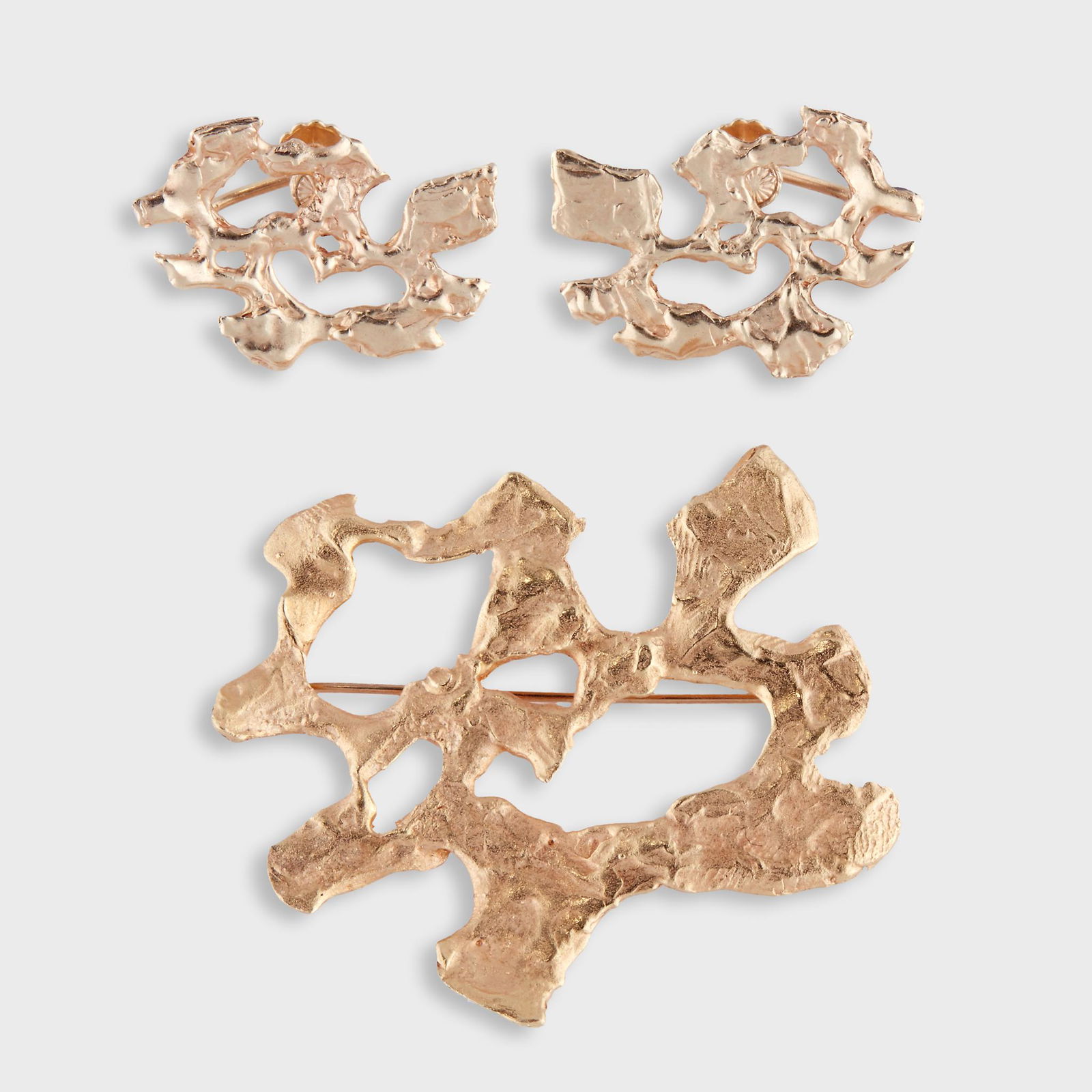 An eighteen karat gold suite, Ed Wiener,: An eighteen karat gold suite, Ed Wiener including a brooch and earrings designed as a textured open form. 17.5 Gross dwt.; Brooch Length: 2 in.; Earring Length: 1 in.