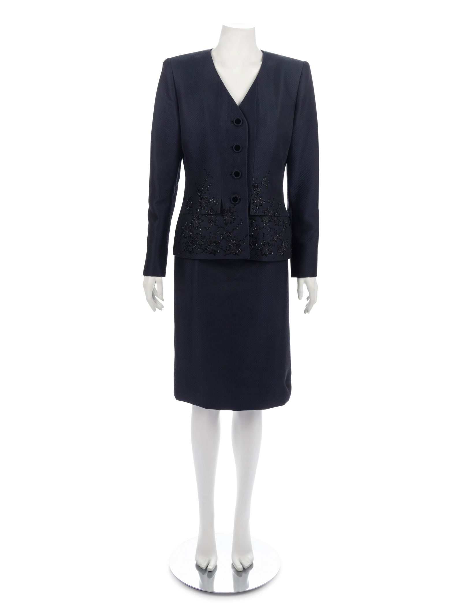 Two Jacket Ensembles, 1980-90s: Oscar de la Renta &: Two Jacket Ensembles, 1980-90s: Oscar de la Renta & Orrier's This lot includes two jacket ensembles. THE FIRST Dark blue acetate/polyester/wool blend dobby skirt suit with a clean neckline jacket with