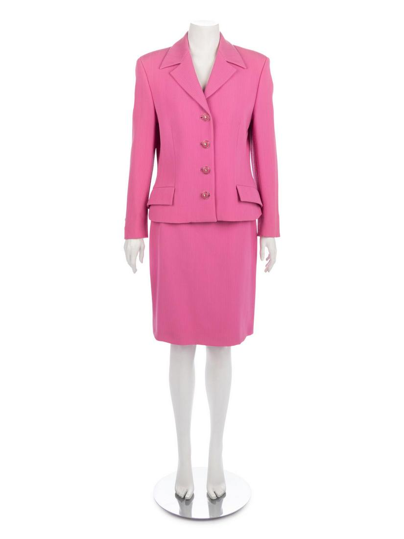 Group of Six Versace Items, 1990s : Group of Six Versace Items, 1990s This lot includes 5 suit sets and one blouse. THE FIRST Cream wool skirt suit with box jacket that has a rolled collar, waist welt pockets, and covered buttons