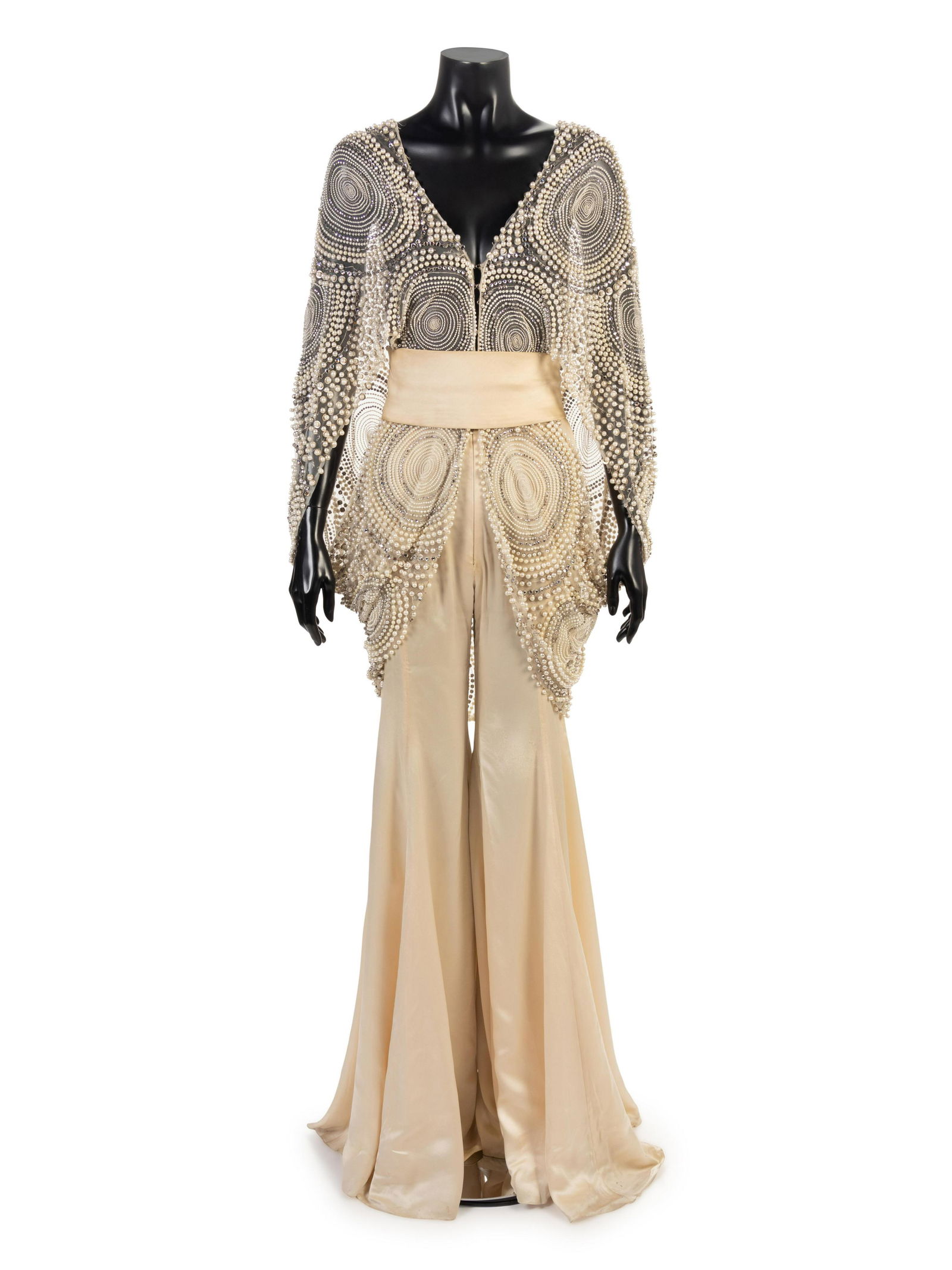 Sarli Evening Ensemble, 2000s: Sarli Evening Ensemble, 2000s This ensemble was purchased by Eunice Walker Johnson of Johnson Publishing Company and worn in the Ebony Fashion Fair. A three piece evening ensemble of top, flared pan