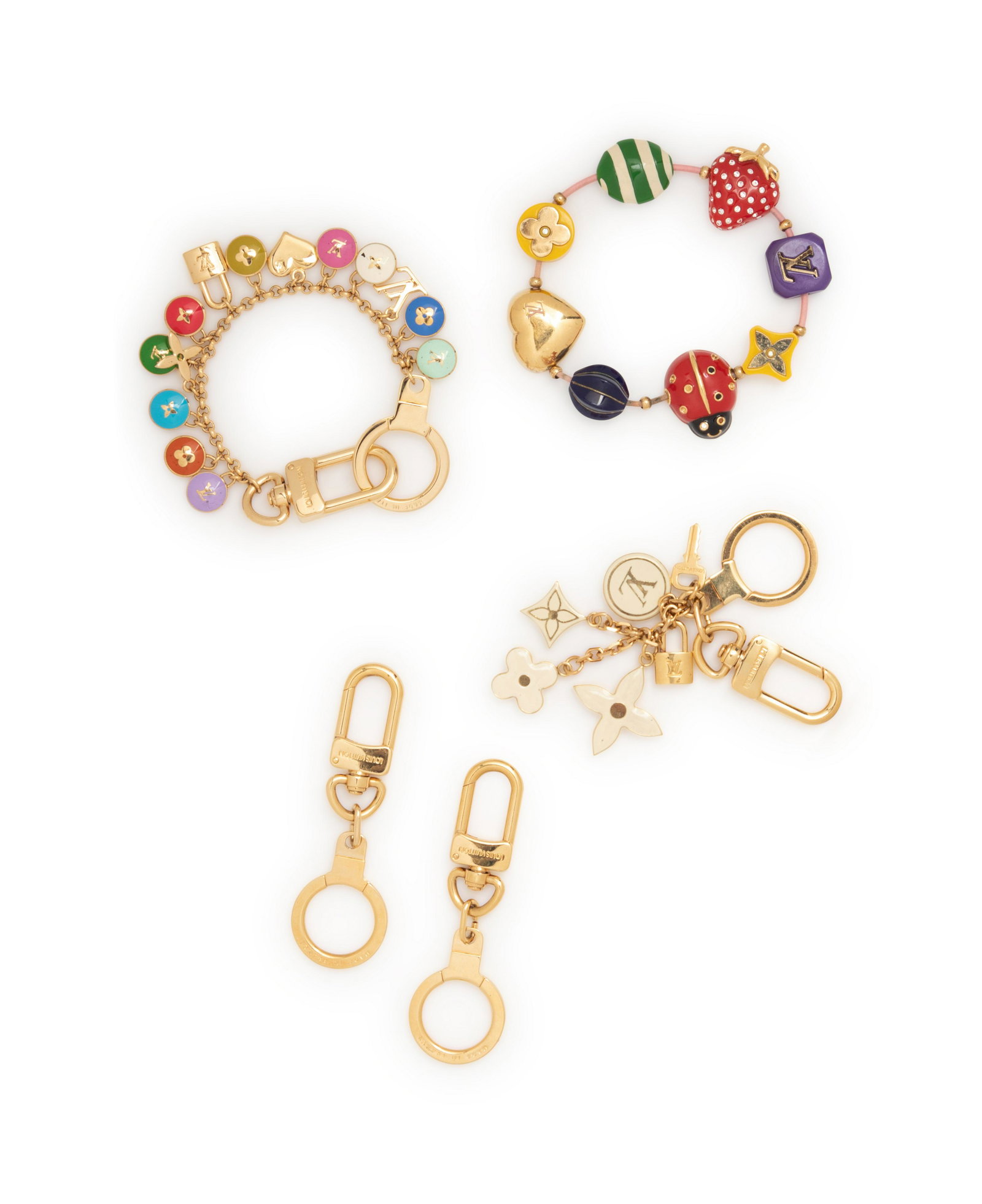 Five Louis Vuitton pieces, 2000-10s: One Bracelet &: Five Louis Vuitton pieces, 2000-10s: One Bracelet & Four Purse/Key Chains This lot includes five pieces; one bracelet and four purse/key chains. THE FIRST Gold-tone metal and multi-hued plastic sh