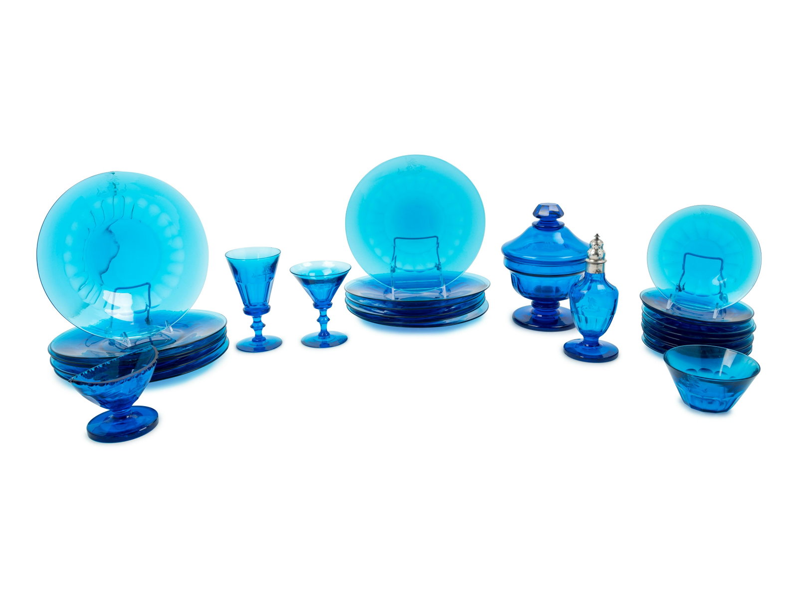A Set of Regency Cobalt Glassware: A Set of Regency Cobalt Glassware Early 19th Century each etched with a banner reading Muneo Et Munio, the bottle with silver mounts for London, dated 1829; comprising 8 wine glasses; 8 champagne glas