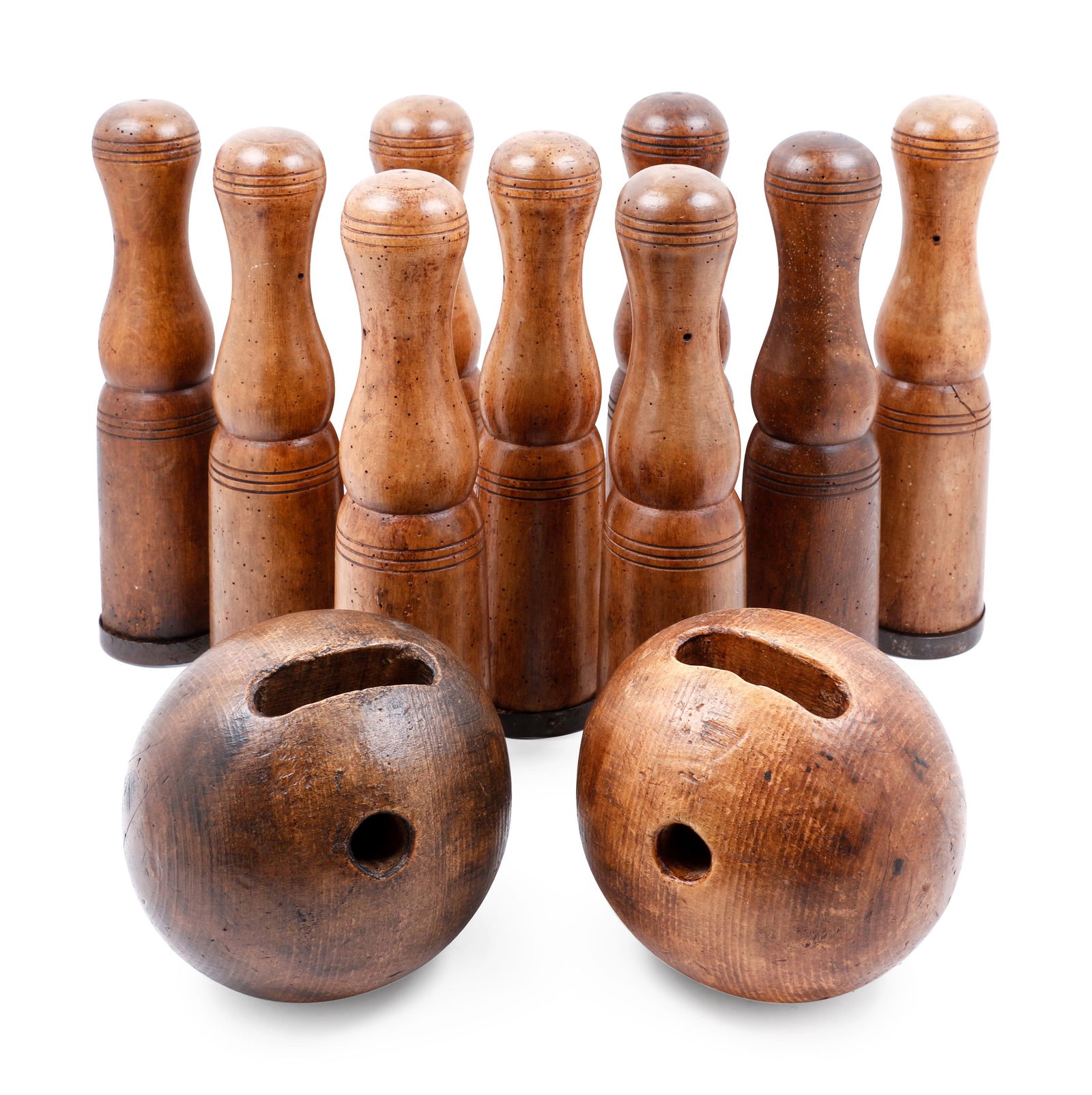 A Group of Carved Wood Bowling Pins and Balls (1 of 1)