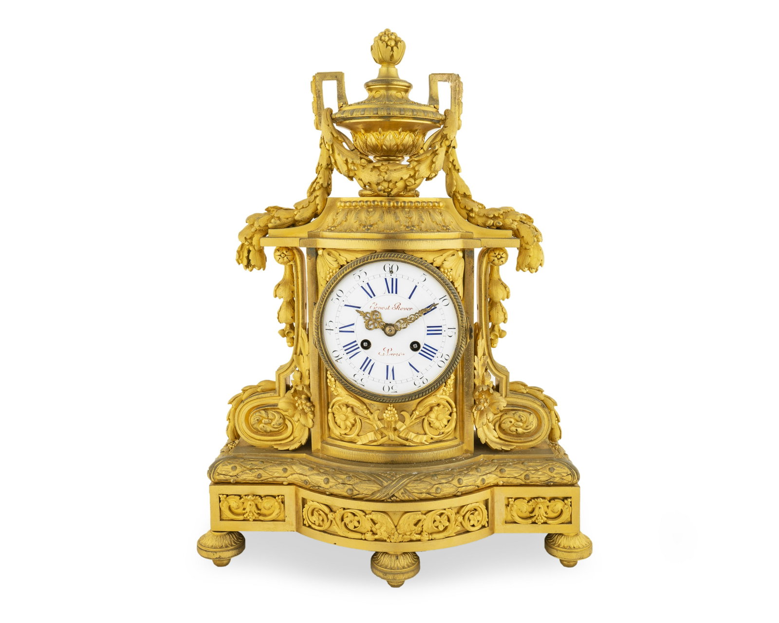 A Louis XVI Style Gilt Bronze ClockDial signed Ernest: A Louis XVI Style Gilt Bronze ClockDial signed Ernest Rover a Paris 19TH CENTURY surmounted by an urn and cast with bellflowers, tied garlands an scrolls throughout, raised on toupie feet. Height 19 1