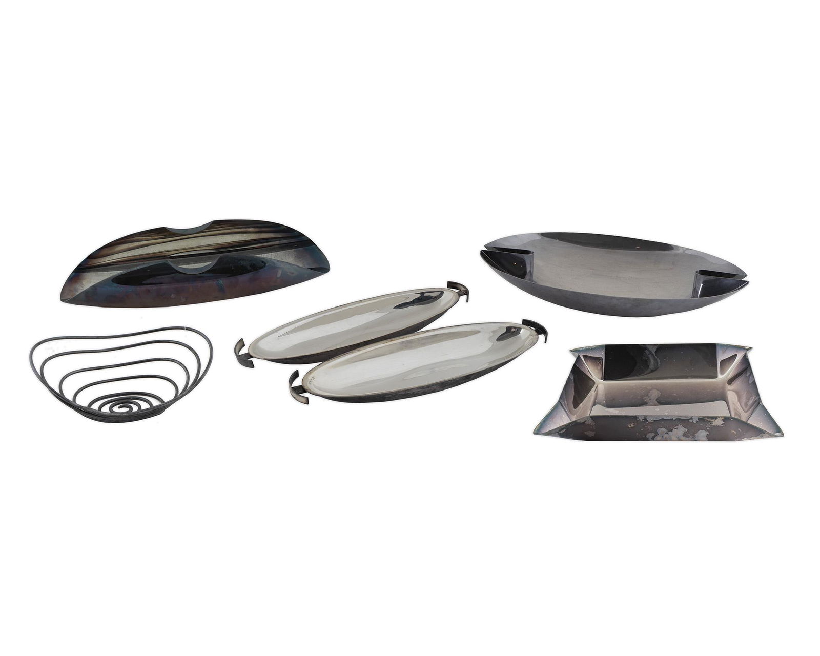 A Group of Seven Italian Stainless Steel Works by Lino: A Group of Seven Italian Stainless Steel Works by Lino Sabattini Length of largest 19 3/4 inches.