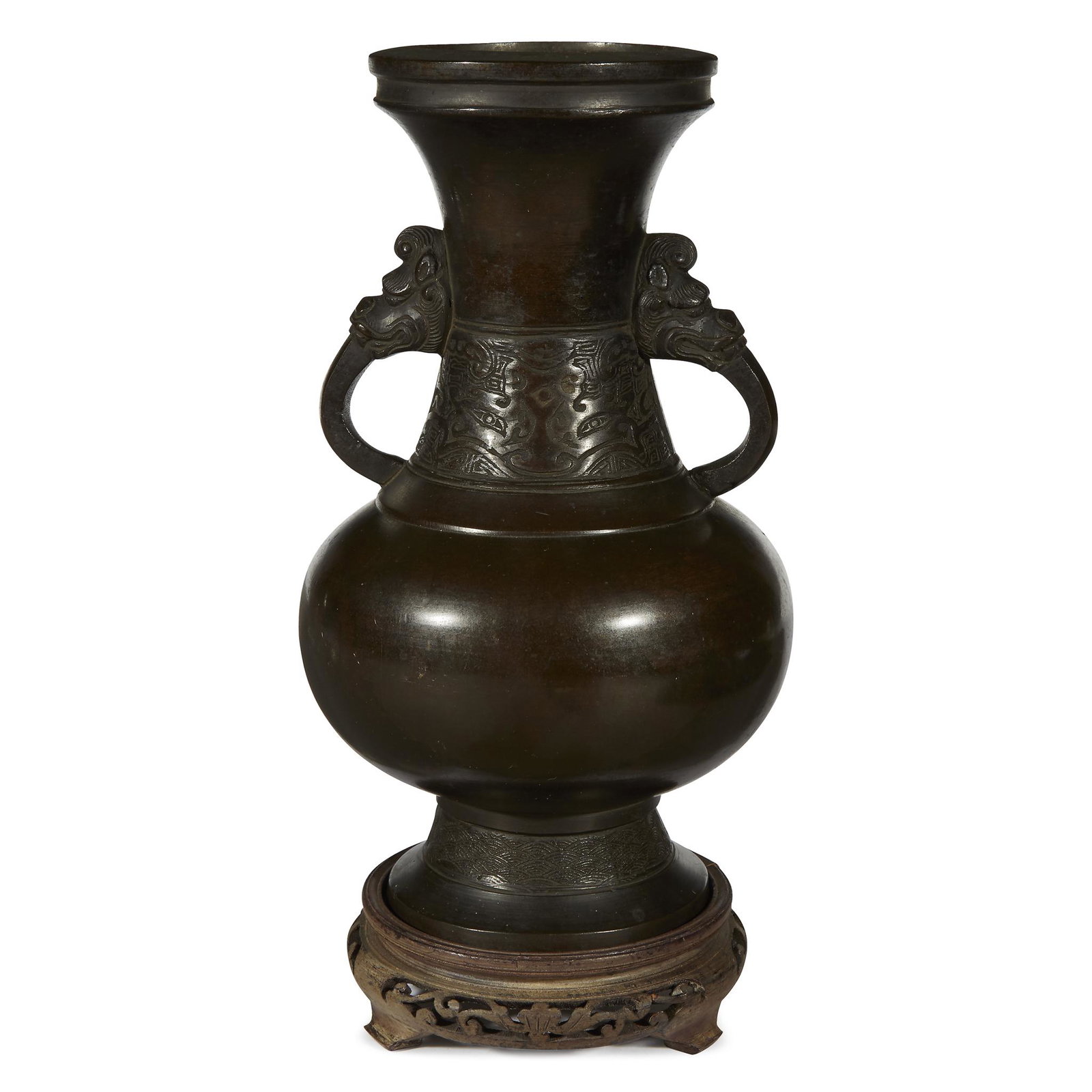 A Japanese patinated bronze archaistic vase, with mask: A Japanese patinated bronze archaistic vase, with mask handles. Edo/early Meiji period. H: 11 1/4 in.