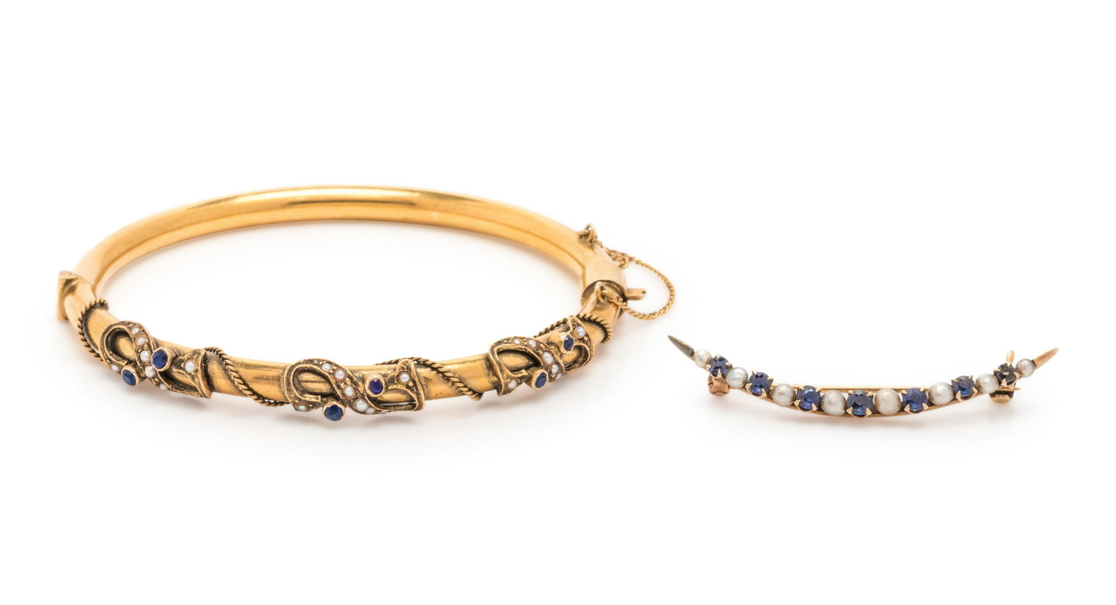 COLLECTION OF ANTIQUE BLUE GLASS AND SEED PEARL JEWELRY: COLLECTION OF ANTIQUE BLUE GLASS AND SEED PEARL JEWELRY Consisting of a bangle with blue glass and rope motif with a safety chain, together with a crescent brooch containing alternating seed pearls an