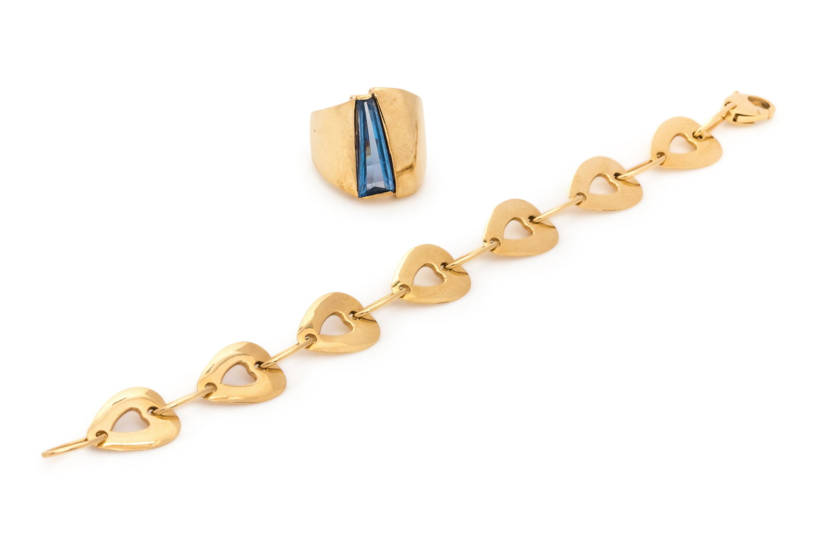COLLECTION OF YELLOW GOLD JEWELRY: COLLECTION OF YELLOW GOLD JEWELRY Consisting of a bracelet with open heart shape links and oval connector links, together with a ring containing one fantasy cut synthetic blue spinel. Bracelet stamp: 