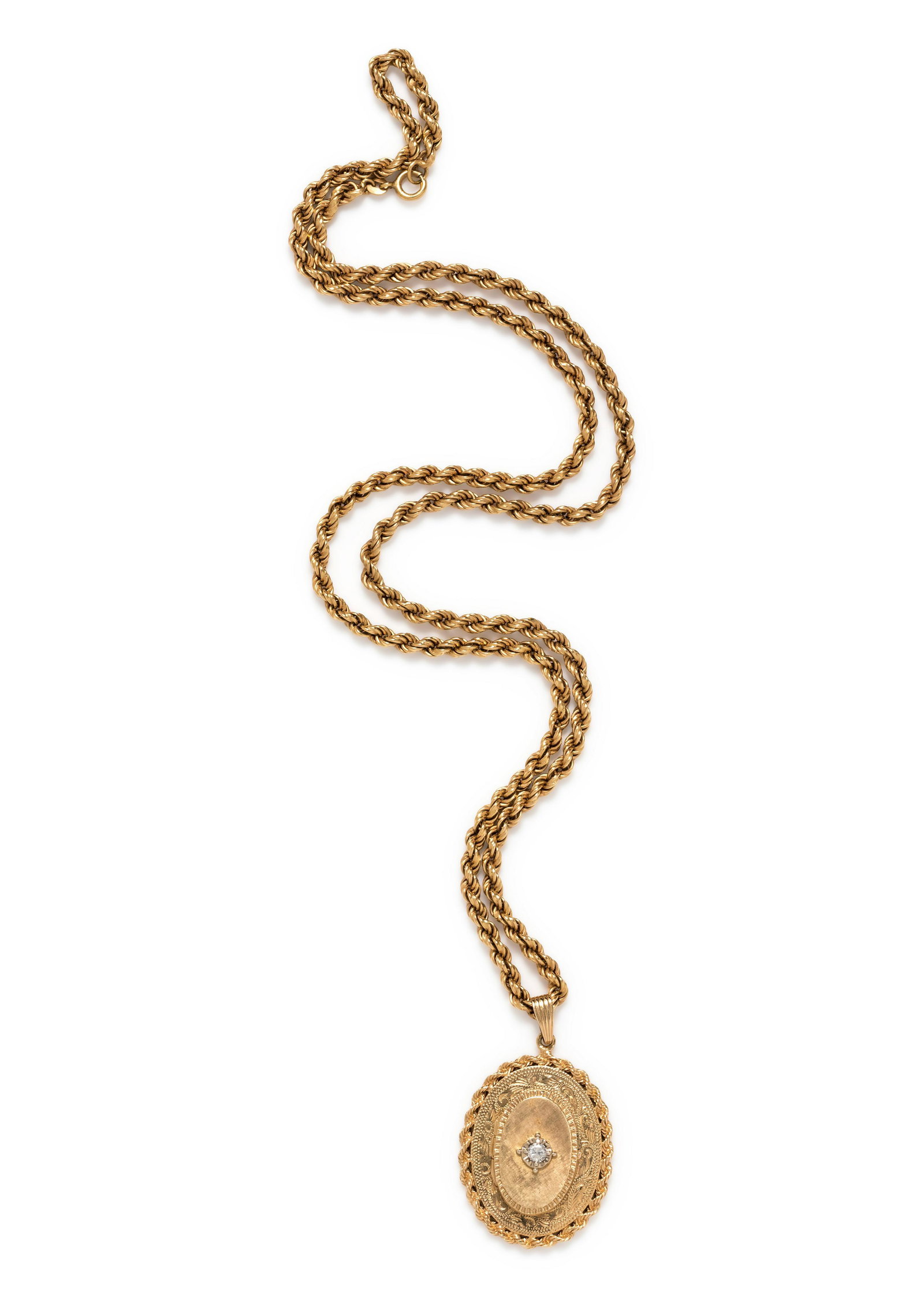 YELLOW GOLD AND DIAMOND LOCKET PENDANT/NECKLACE: YELLOW GOLD AND DIAMOND LOCKET PENDANT/NECKLACE Consisting of a locket containing one round brilliant cut diamond weighing approximately 0.15 carat, suspended from a rope longchain necklace. Pendant s