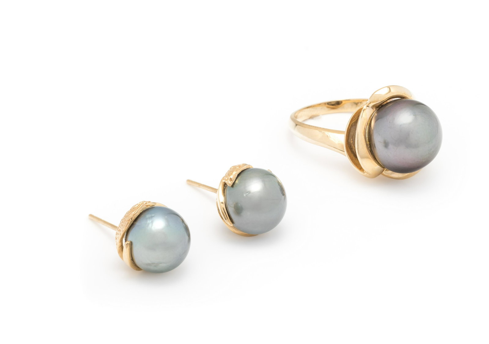COLLECTION OF CULTURED TAHITIAN PEARL JEWELRY: COLLECTION OF CULTURED TAHITIAN PEARL JEWELRY Consisting of a ring containing one Tahitian pearl measuring approximately 12.00 mm in diameter and a pair of stud earrings containing two Tahitian pearls