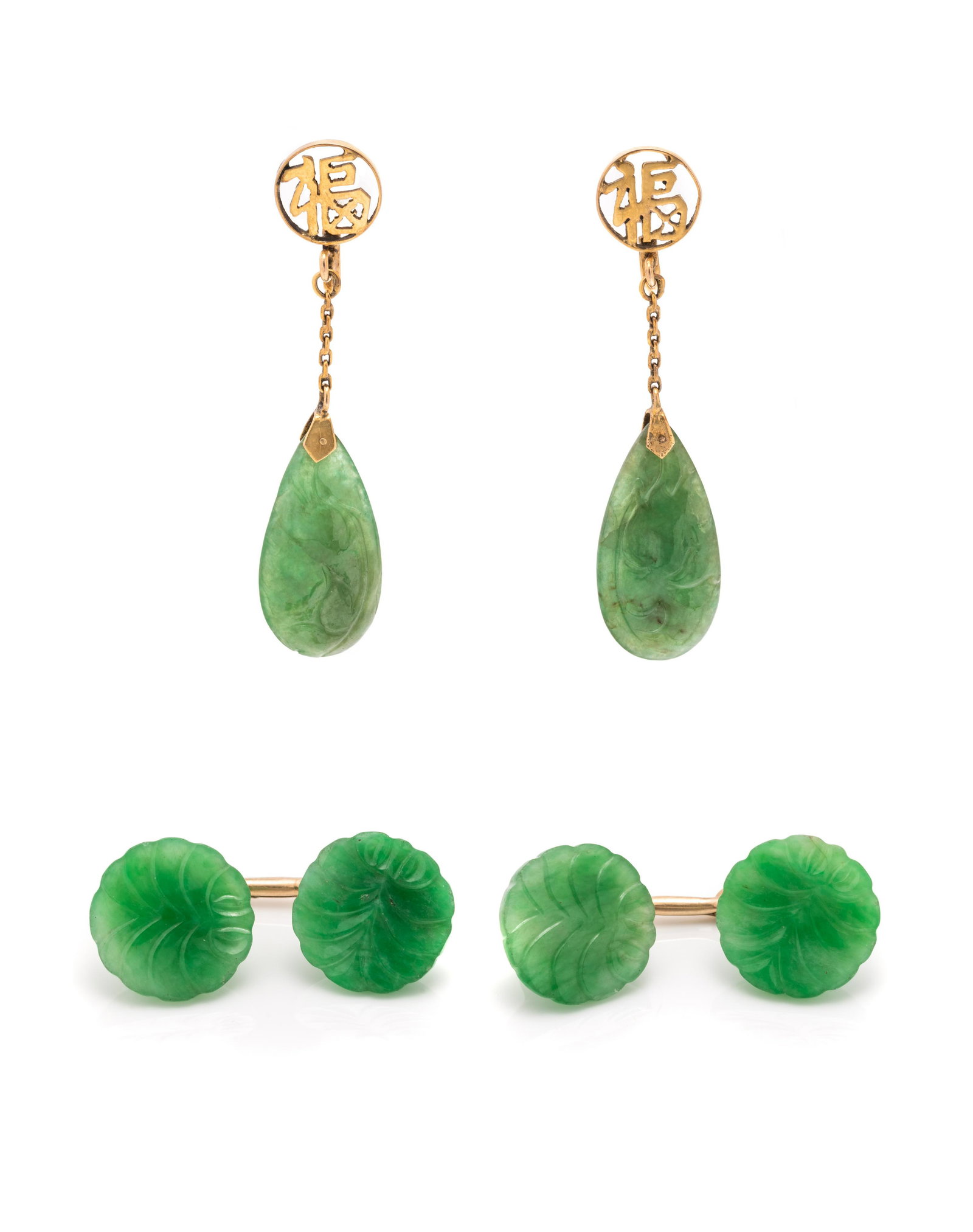 JADEITE SET: JADEITE SET Consisting of a pair of yellow gold and jade cufflinks containing four round carved jade plaques measuring approximately 13.00 mm in diameter, together with a pair of earclips containing t