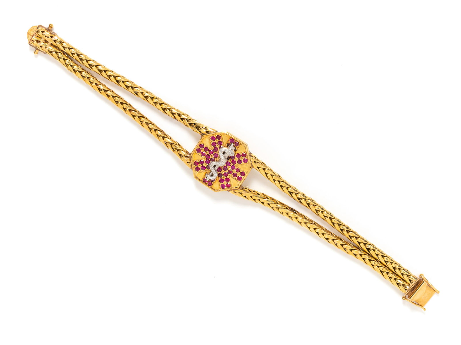 YELLOW GOLD, DIAMOND AND RUBY MEDIC ALERT BRACELET: YELLOW GOLD, DIAMOND AND RUBY MEDIC ALERT BRACELET Consisting of two wheat chains with central octagonal plaque depicting the 'Star of Life' containing 25 round brilliant cut diamonds weighing approxi