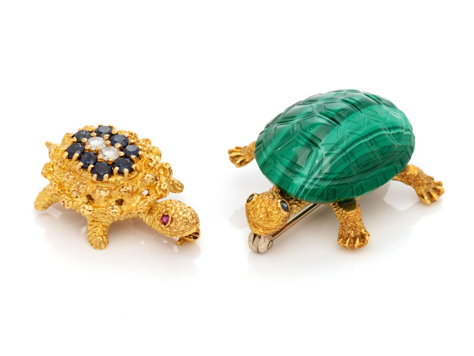 COLLECTION OF YELLOW GOLD TURTLE BROOCHES: COLLECTION OF YELLOW GOLD TURTLE BROOCHES Consisting of a brooch with carved malachite shell and sapphire eyes, together with a brooch containing eight round mixed cut sapphires measuring approximatel