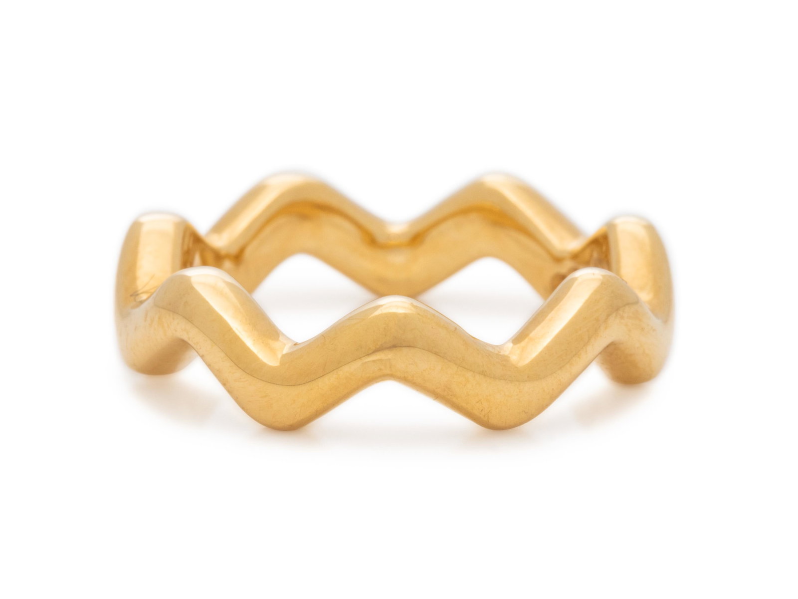 TIFFANY & CO., PALOMA PICASSO, YELLOW GOLD 'ZIG ZAG': TIFFANY & CO., PALOMA PICASSO, YELLOW GOLD 'ZIG ZAG' RING Measuring approximately 6.50 mm wide. Stamp: Paloma Picasso TIFFANY & Co. 750. 4.80 dwt. Accompanied by a Tiffany & Co. inner and outer box.