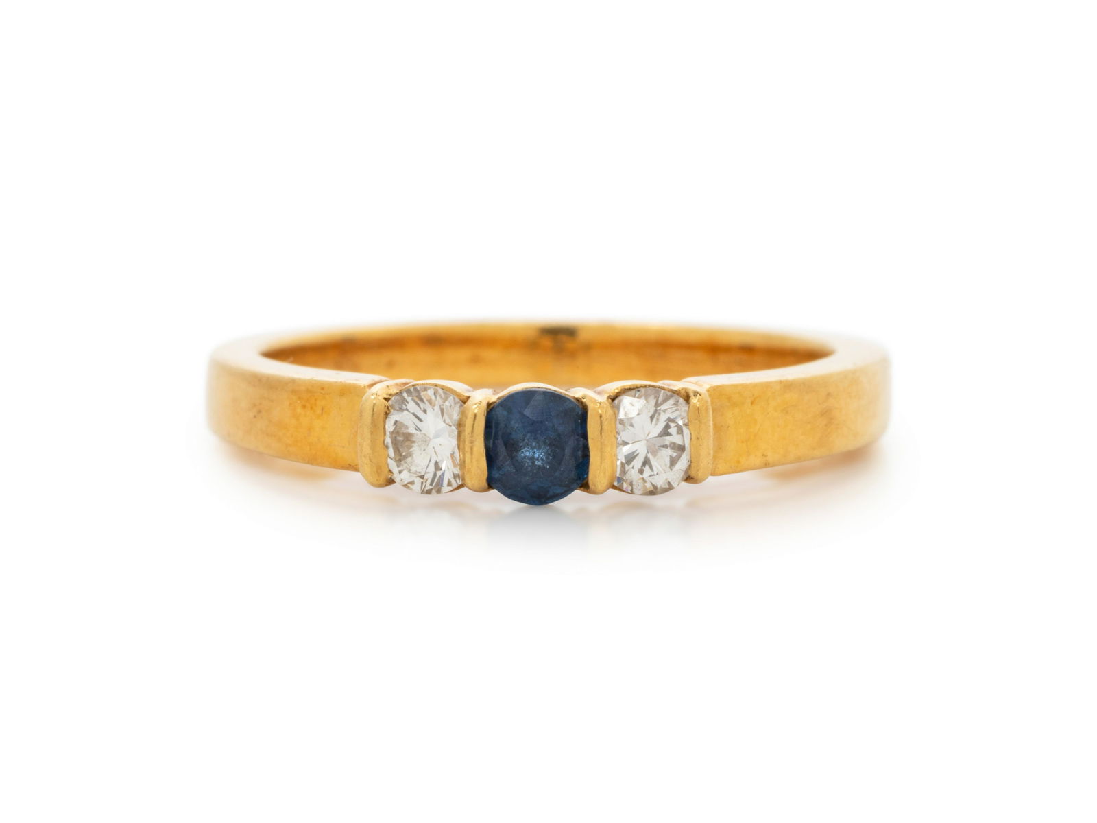 TIFFANY & CO, YELLOW GOLD, SAPPHIRE AND DIAMOND RING: TIFFANY & CO, YELLOW GOLD, SAPPHIRE AND DIAMOND RING Containing one round mixed cut sapphire measuring approximately 3.35 mm in diameter and two round brilliant cut diamonds weighing approximately 0.2