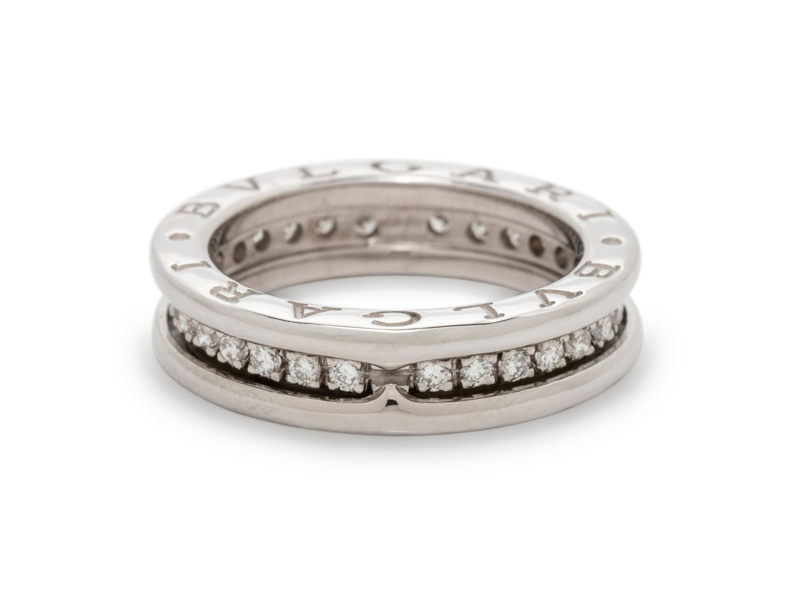 BVLGARI, WHITE GOLD AND DIAMOND 'B.ZERO1' RING: BVLGARI, WHITE GOLD AND DIAMOND 'B.ZERO1' RING Containing 30 round brilliant cut diamonds weighing approximately 0.45 carat total. Stamp: 87 (Italian hallmark) MADE IN ITALY 750 BVLGARI. 3.80 dwt.