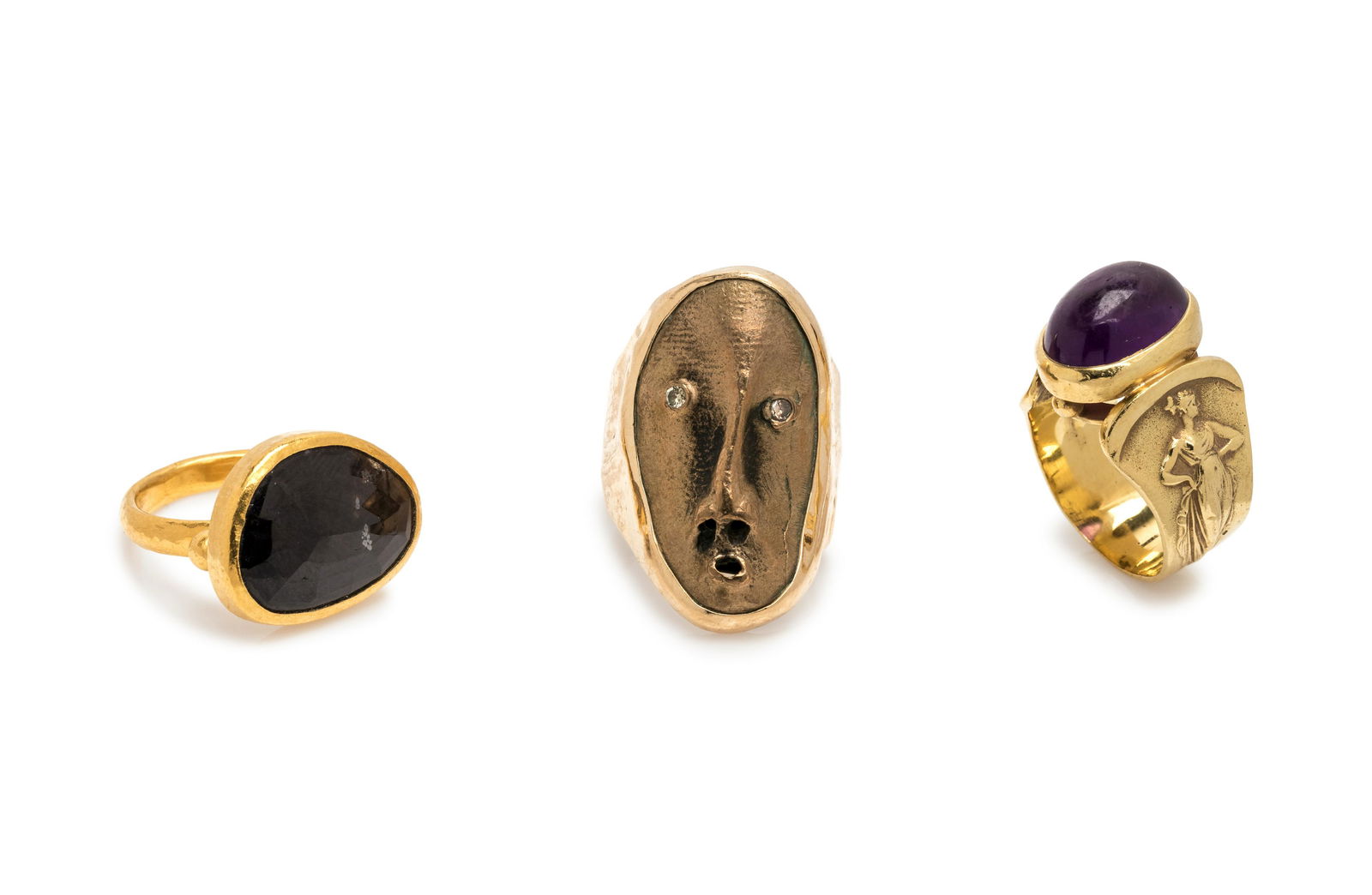 COLLECTION OF YELLOW GOLD RINGS: COLLECTION OF YELLOW GOLD RINGS Consisting of a high karat gold ring by Gurhan containing one freeform labradorite measuring approximately 13.75 x 18.30 mm, a ring by Jim Cotter containing a bronze ma