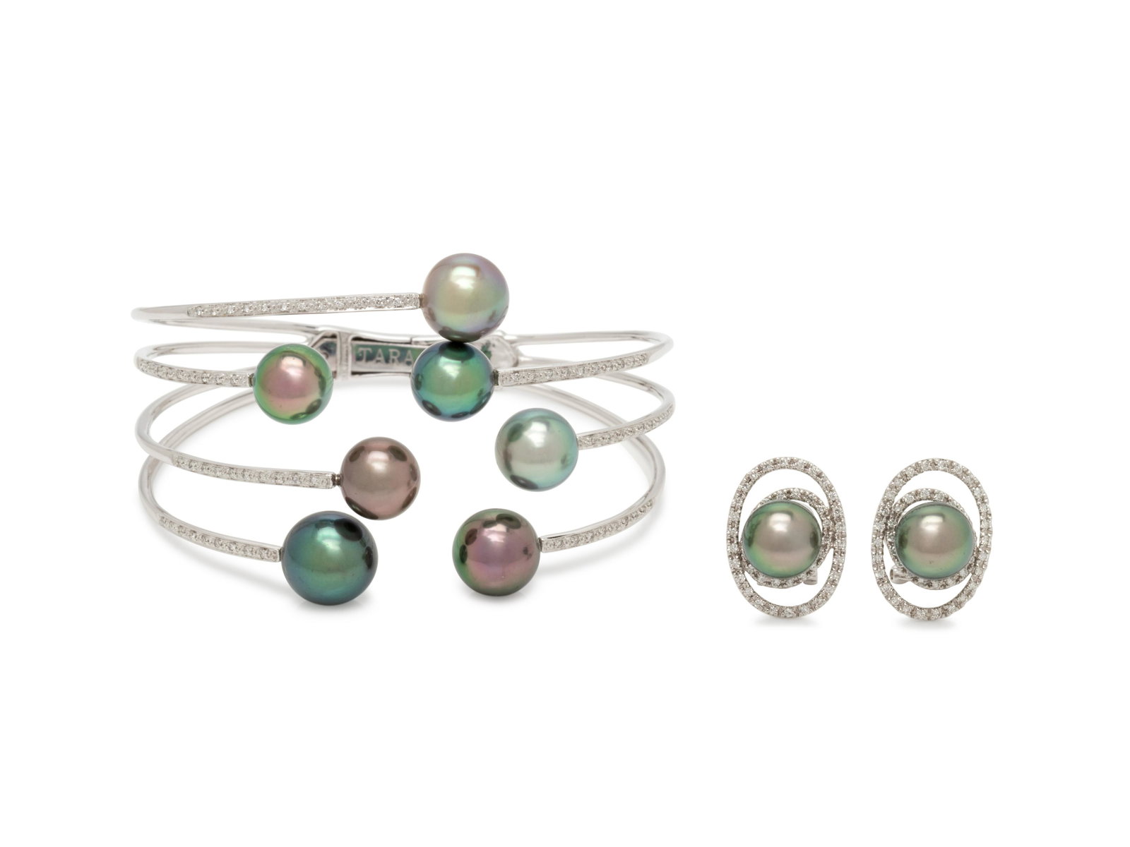 CULTURED TAHITIAN PEARL AND DIAMOND SET: CULTURED TAHITIAN PEARL AND DIAMOND SET Consisting of a cuff bracelet containing seven Tahitian pearls measuring approximately 8.85-10.30 mm in diameter and 72 round brilliant cut diamonds weighing ap